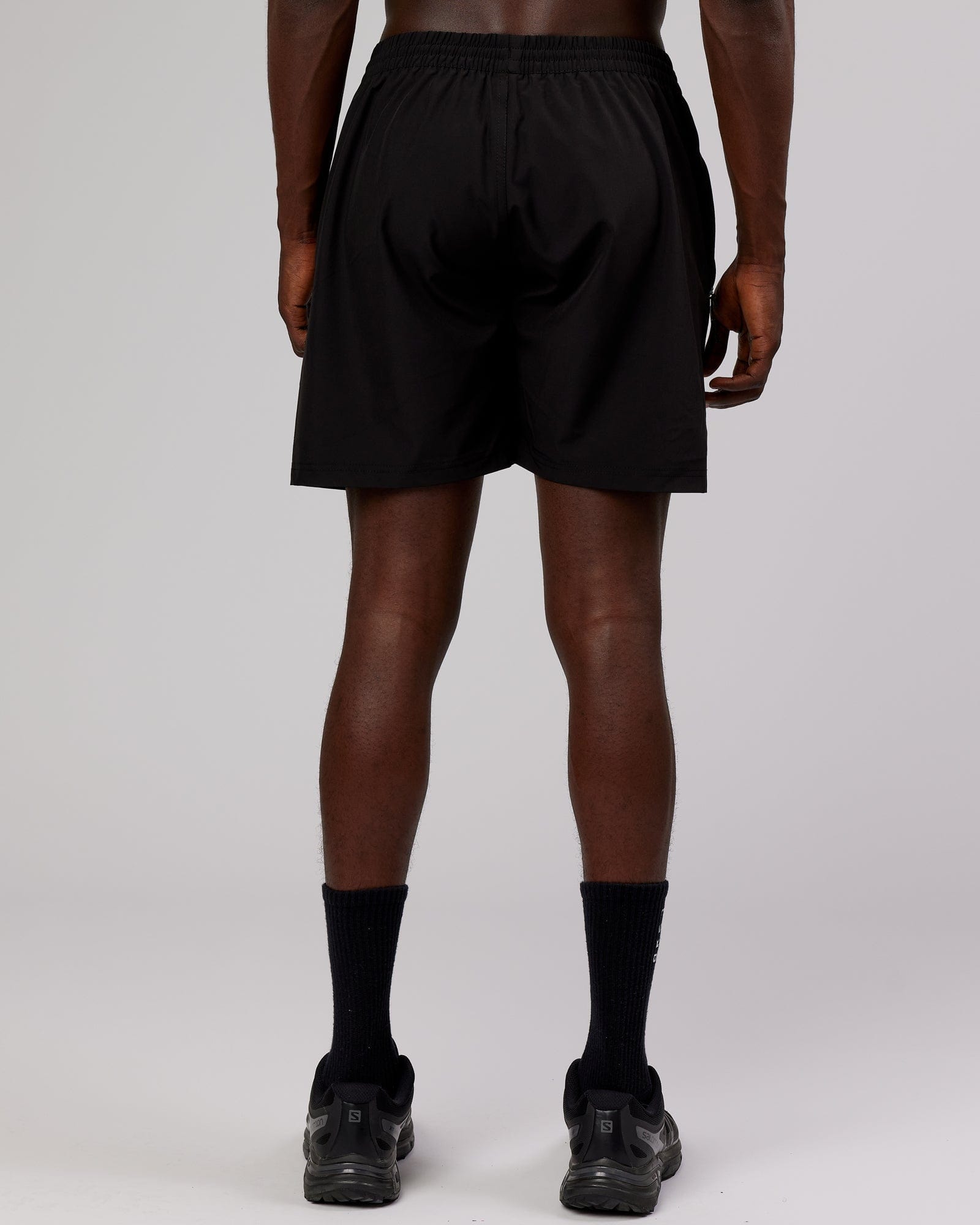 Model wearing Rep 7'' Performance Short - Black-Pink