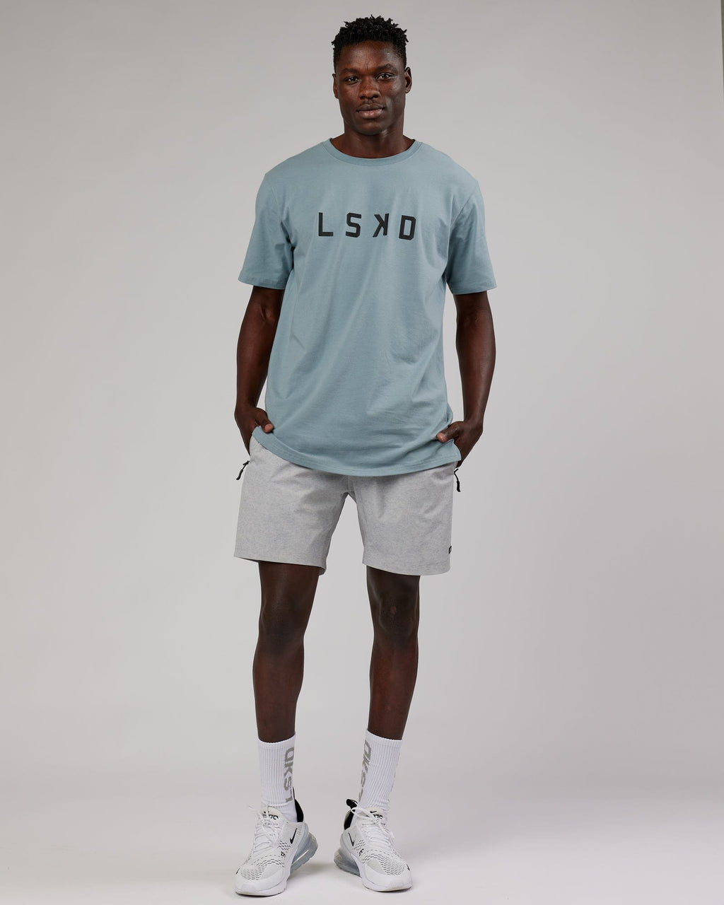 Model wearing Rep 7" Performance Short - Light Grey Marl