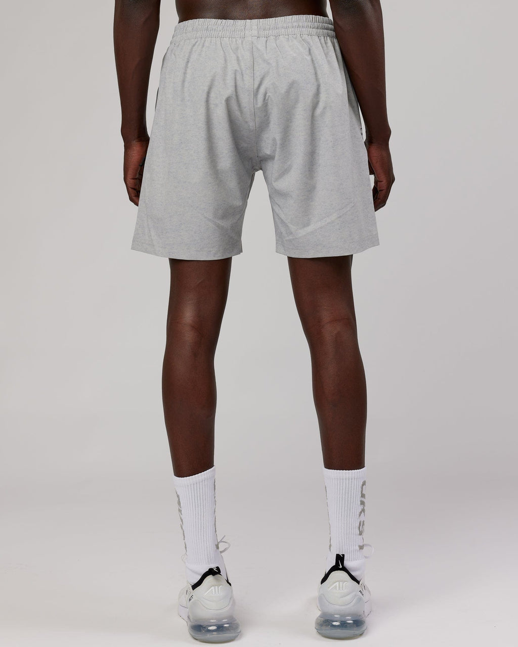 Model wearing Rep 7" Performance Short - Light Grey Marl