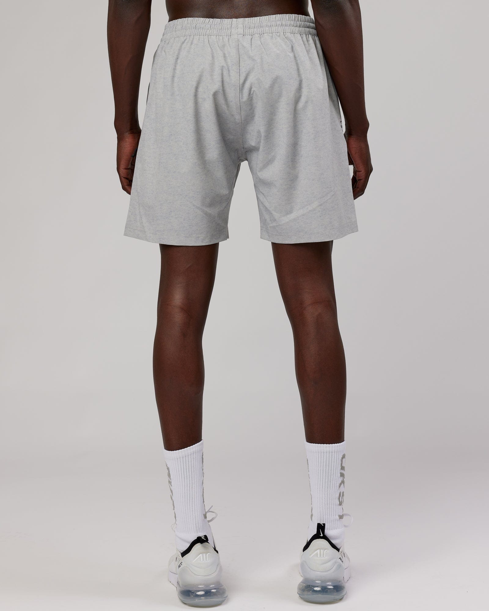 Model wearing Rep 7" Performance Short - Light Grey Marl