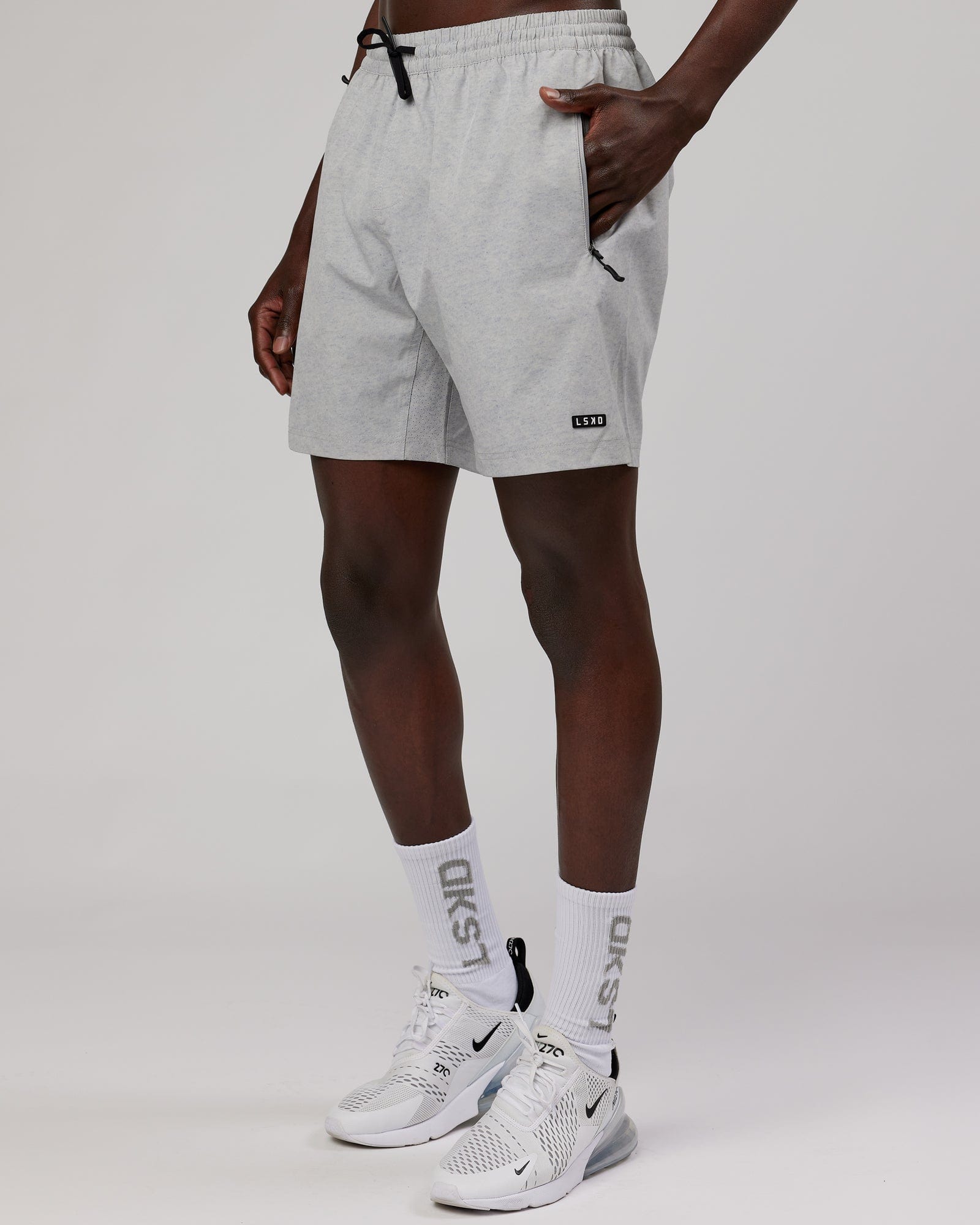 Model wearing Rep 7" Performance Short - Light Grey Marl