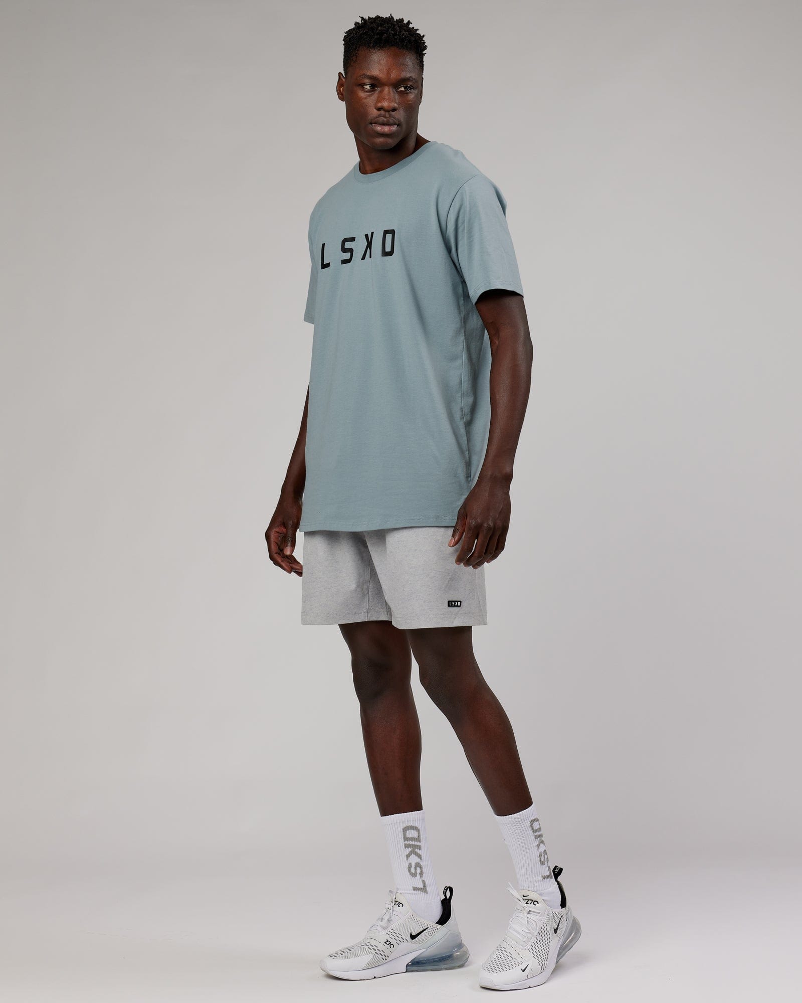 Model wearing Rep 7" Performance Short - Light Grey Marl