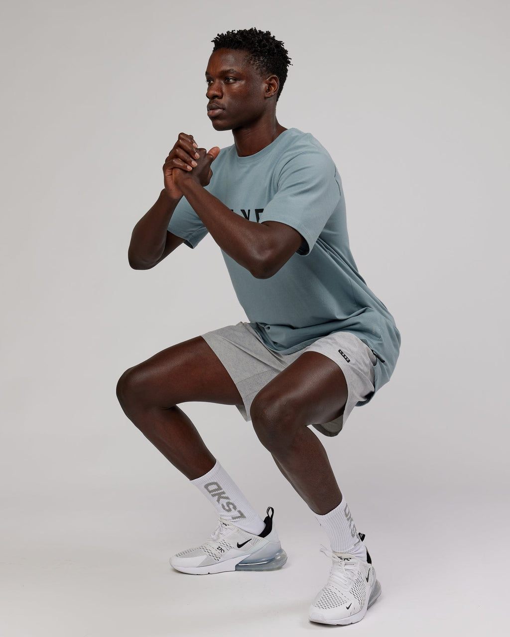 Model wearing Rep 7" Performance Short - Light Grey Marl