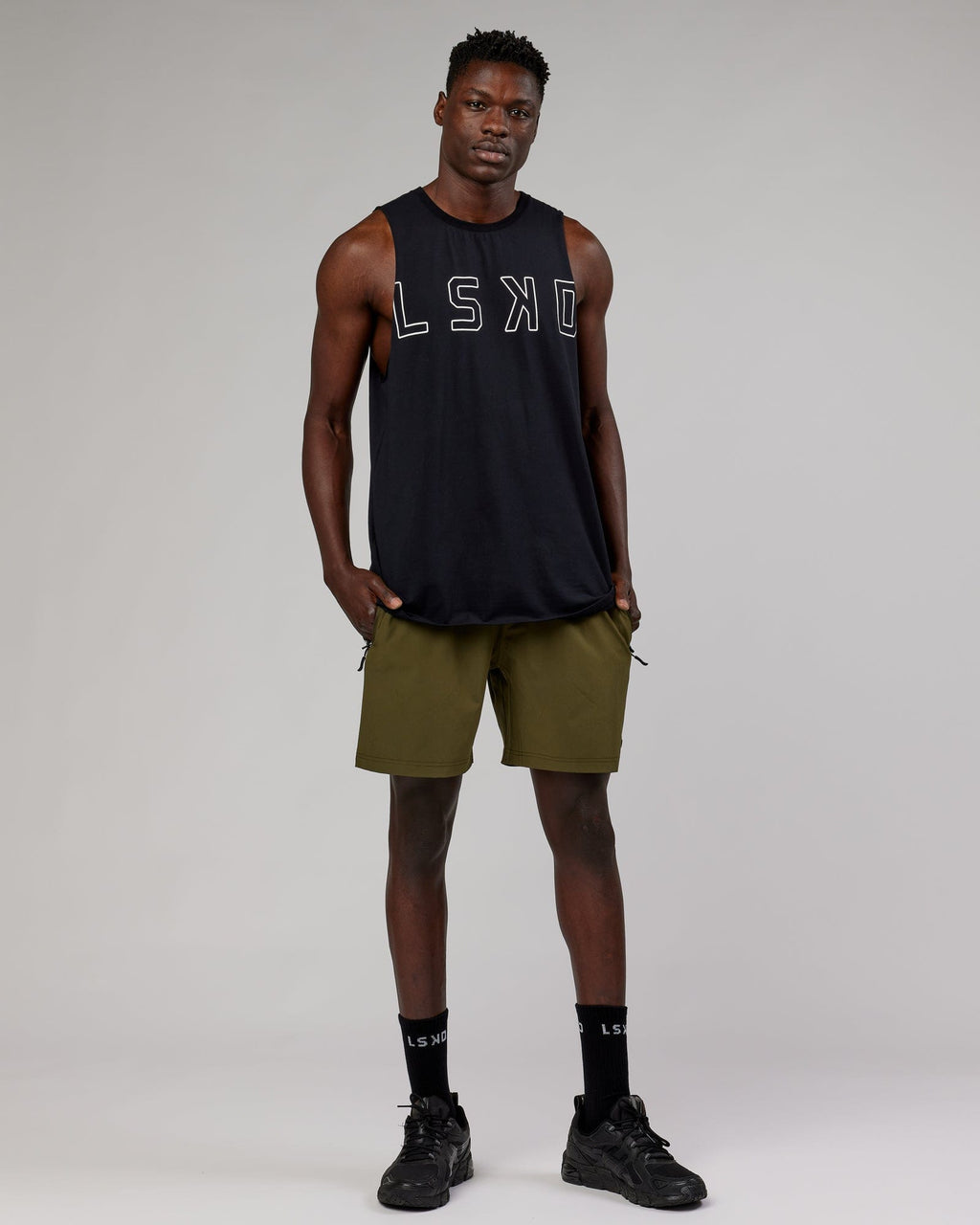 Model wearing Rep 7'' Performance Short - Olive