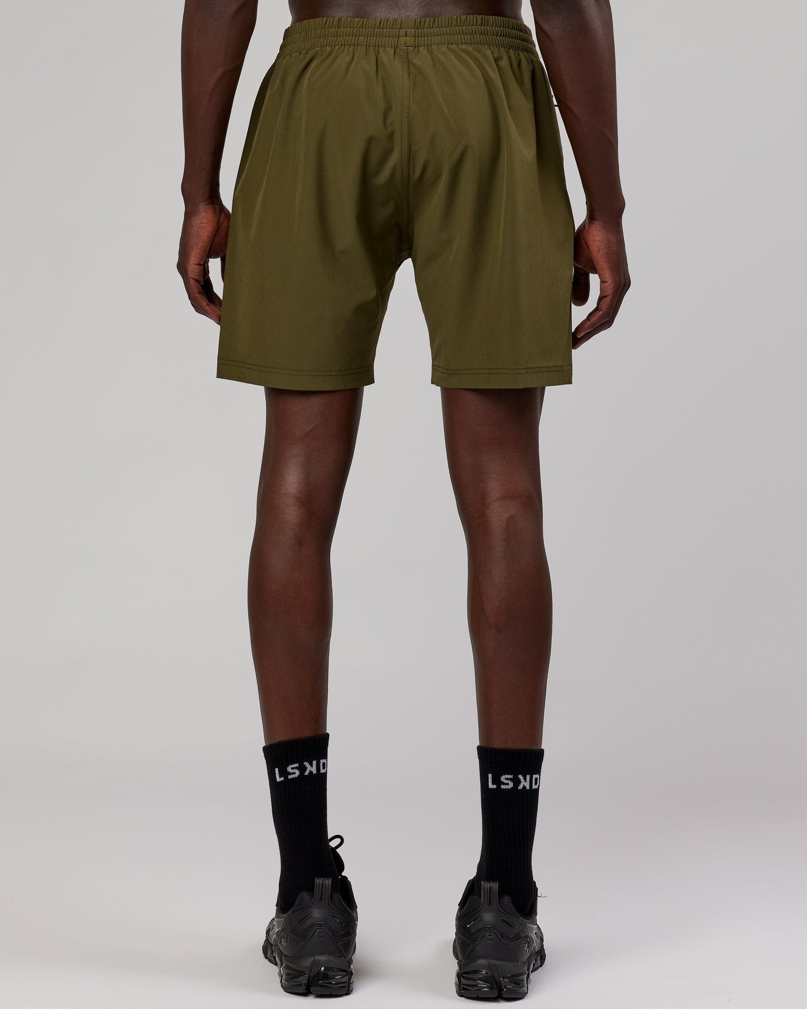 Model wearing Rep 7'' Performance Short - Olive