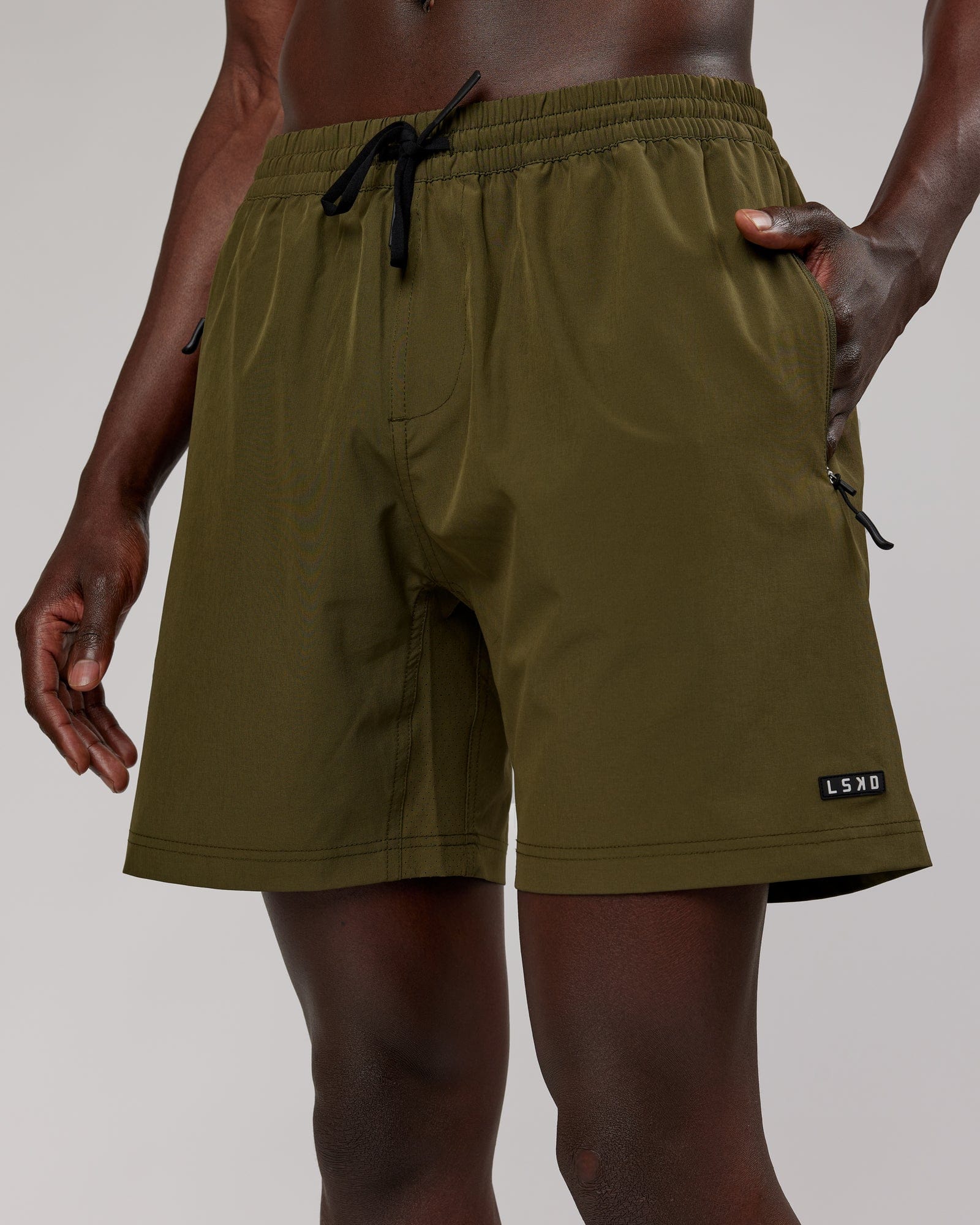Model wearing Rep 7'' Performance Short - Olive