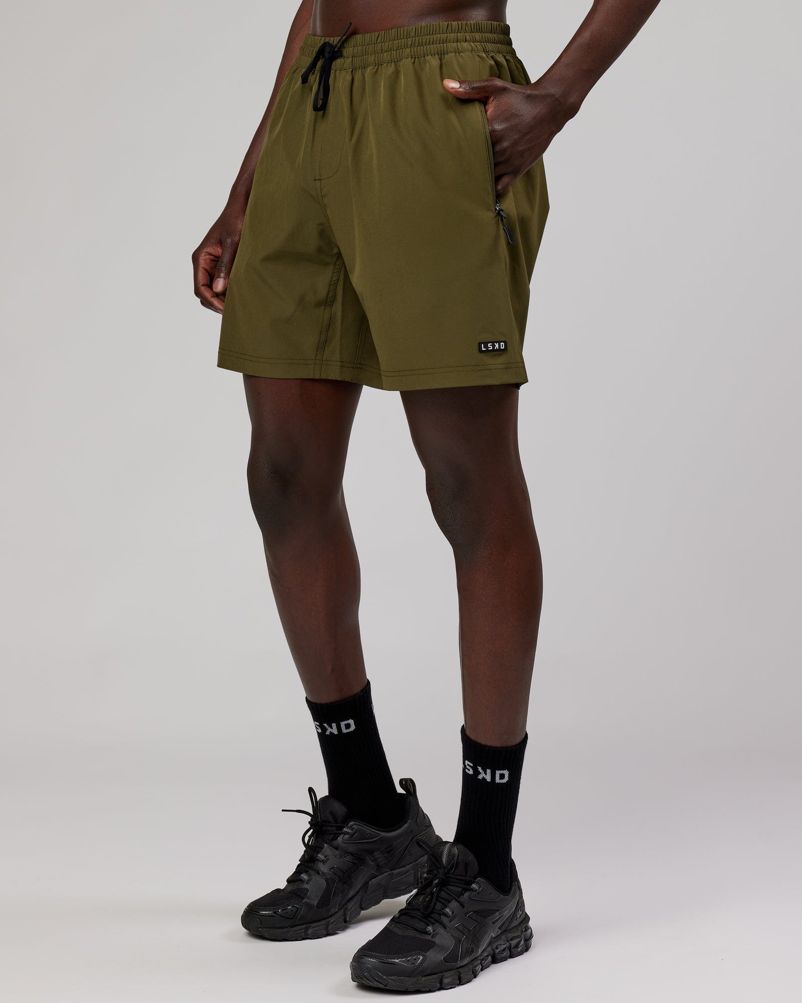 Model wearing Rep 7'' Performance Short - Olive