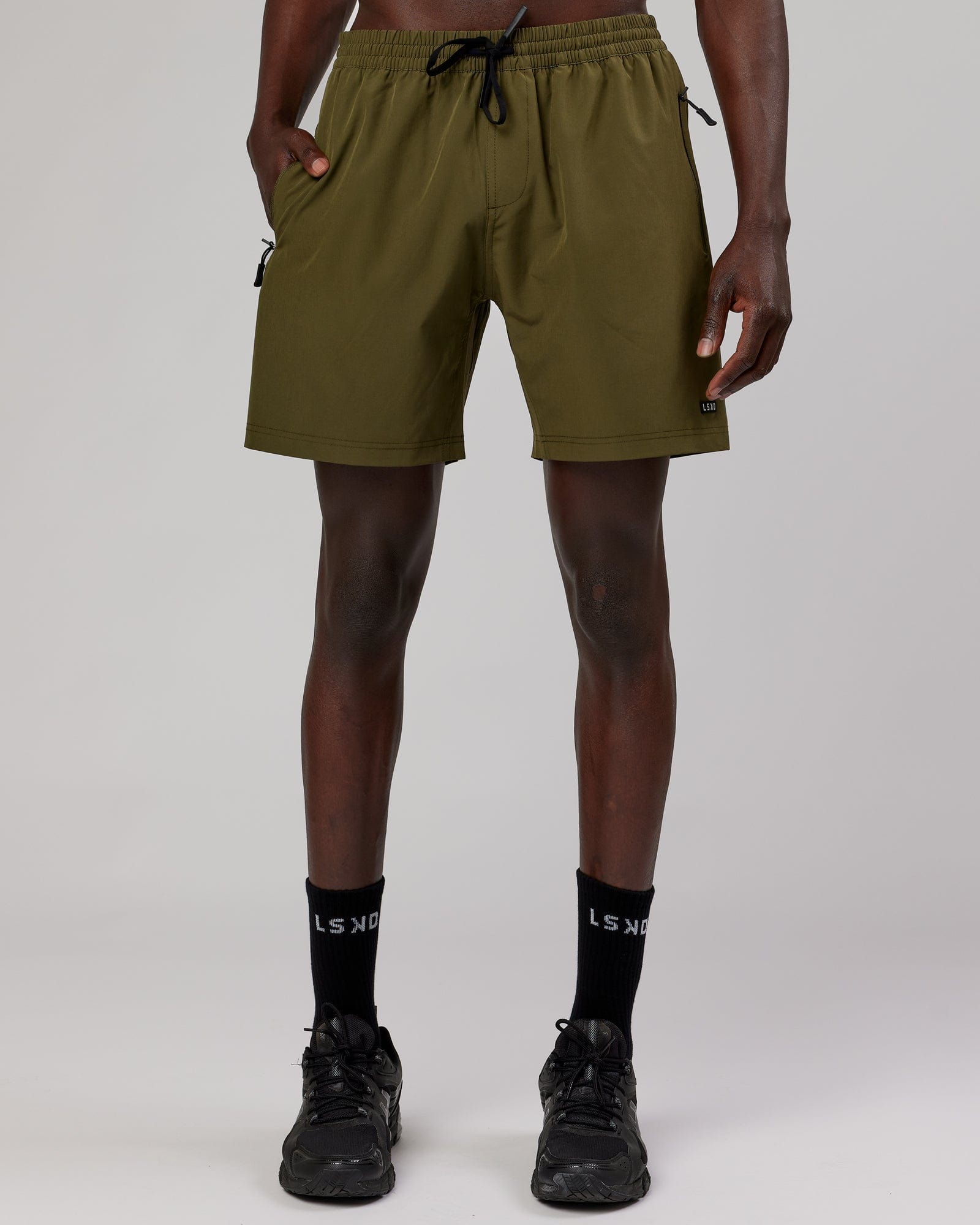 Model wearing Rep 7'' Performance Short - Olive