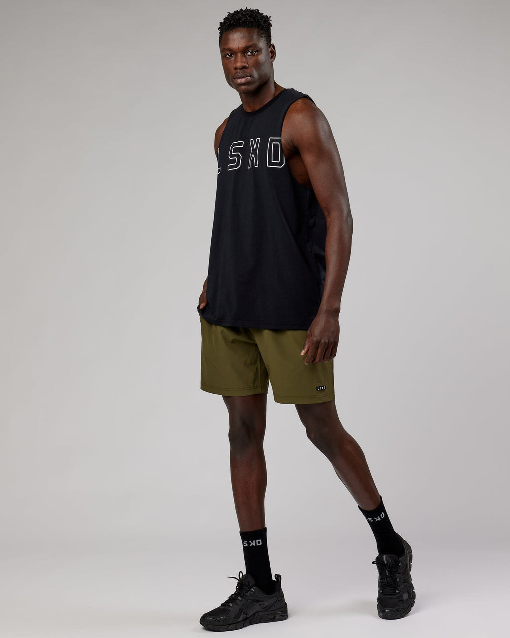 Model wearing Rep 7'' Performance Short - Olive