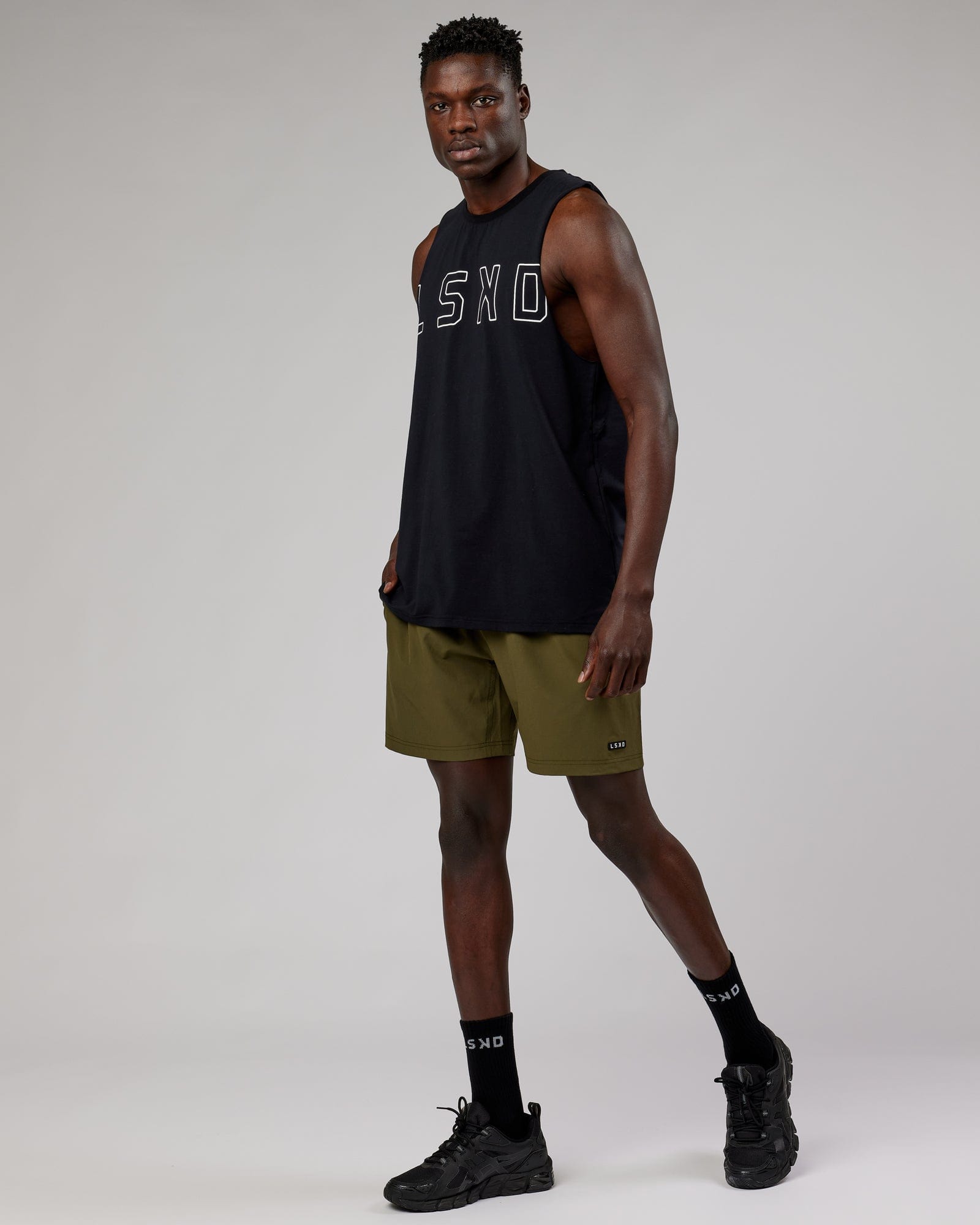 Model wearing Rep 7'' Performance Short - Olive