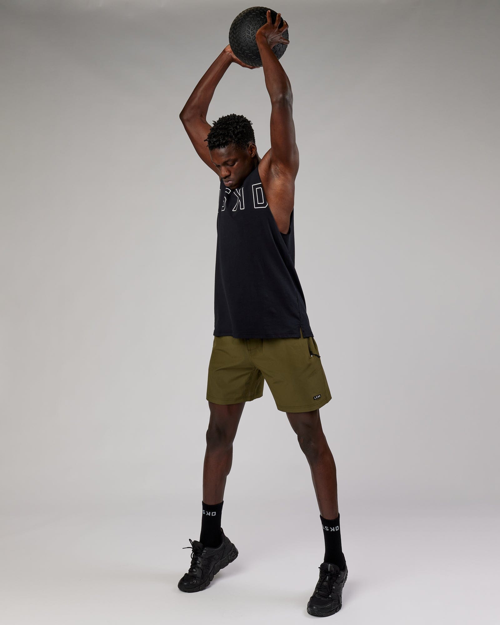 Model wearing Rep 7'' Performance Short - Olive