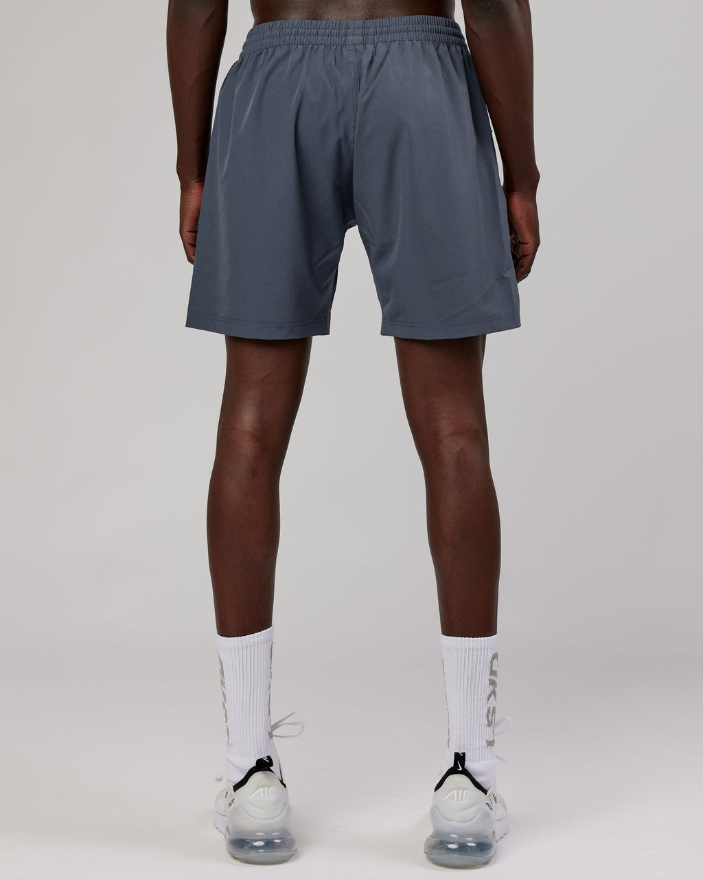 Model wearing Rep 7" Performance Short - Turbulence