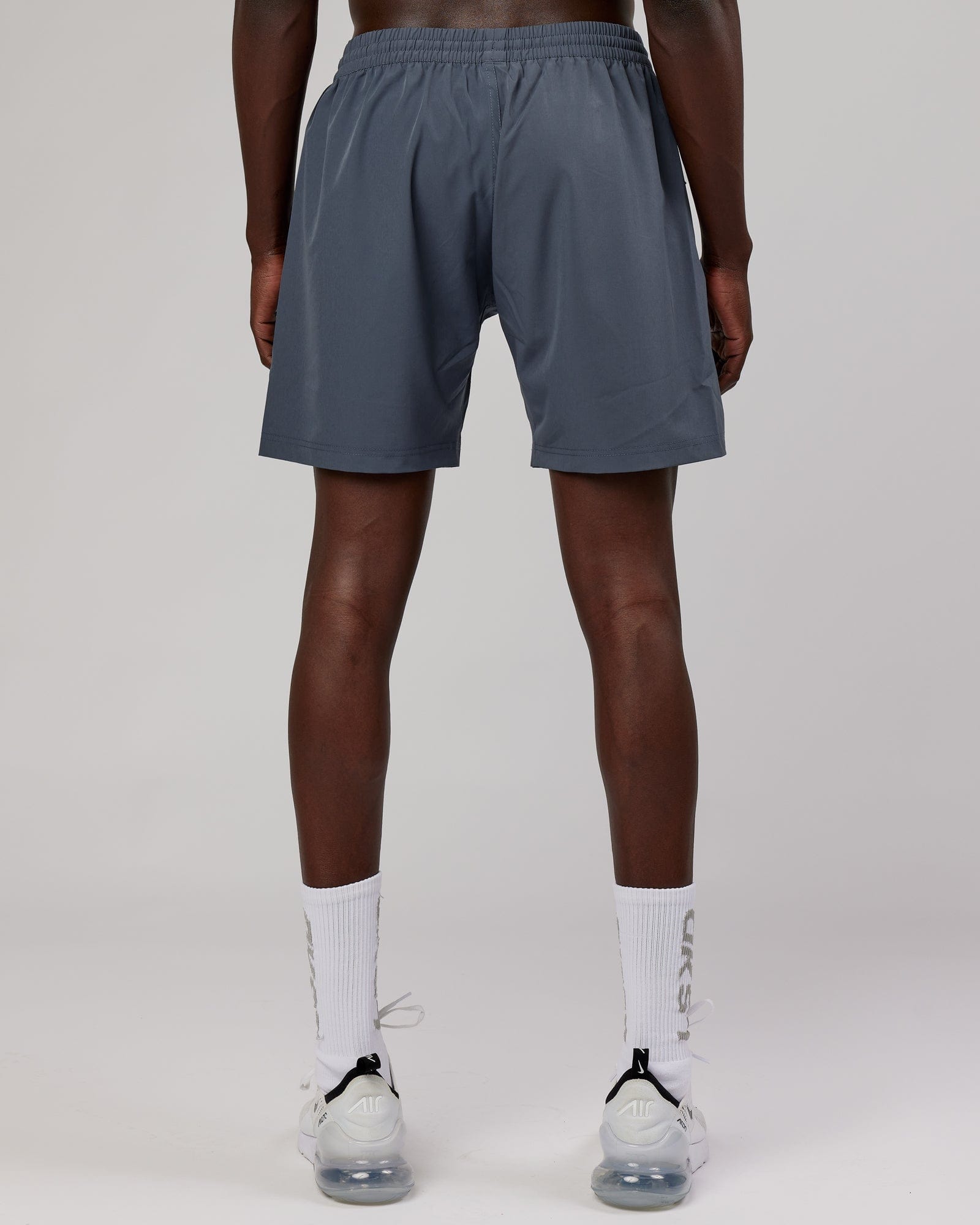 Model wearing Rep 7" Performance Short - Turbulence