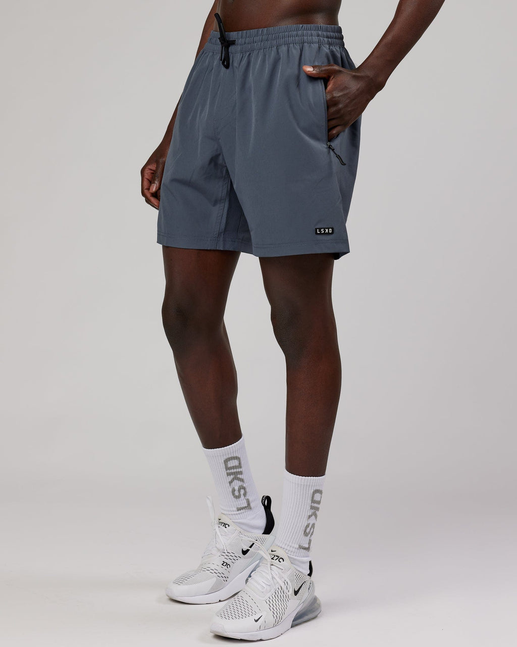 Model wearing Rep 7" Performance Short - Turbulence