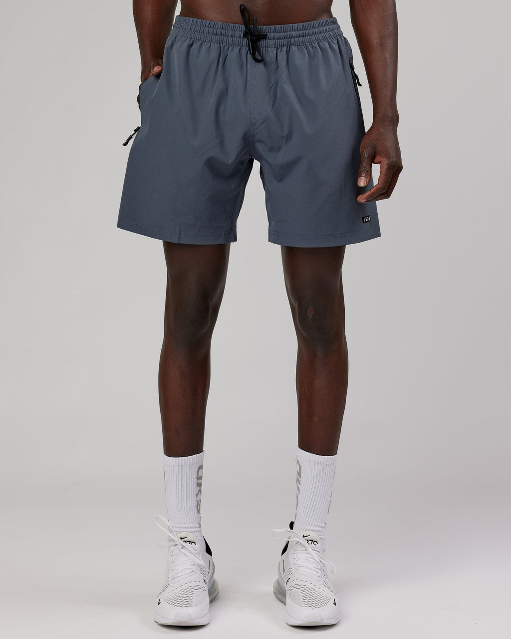 Model wearing Rep 7" Performance Short - Turbulence