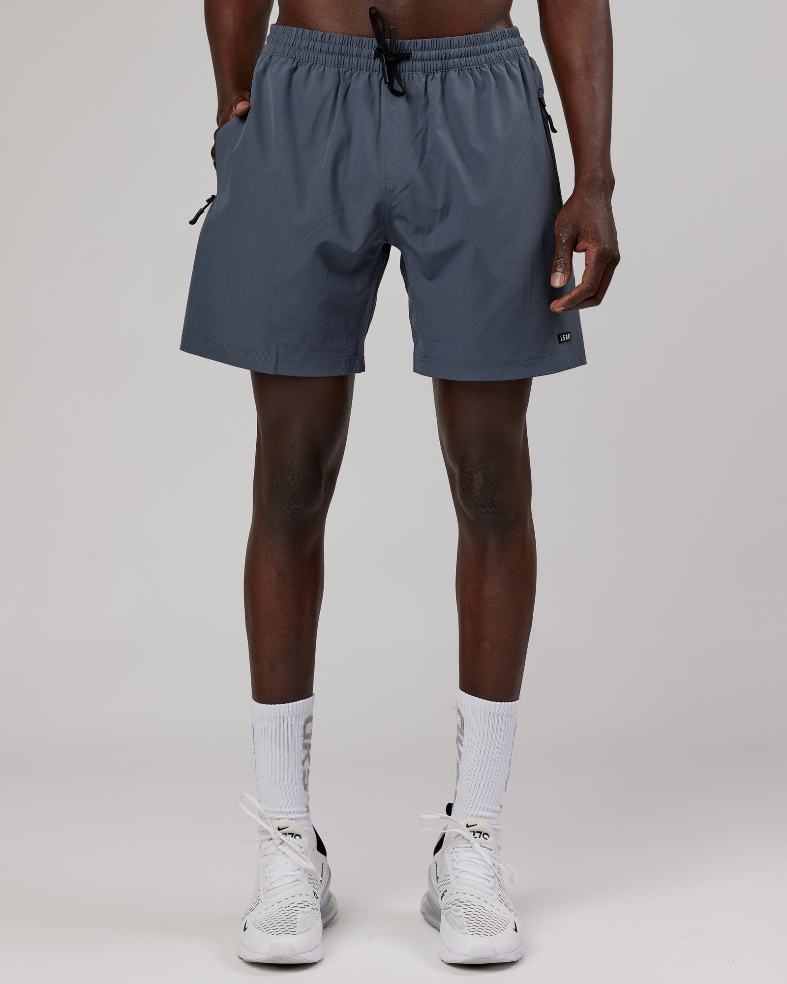 Model wearing Rep 7" Performance Short - Turbulence