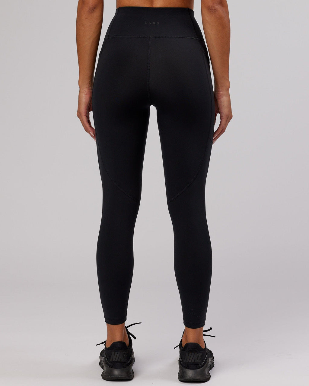 Model wearing Rep 7/8 Length Tight - Black-Cornflower Blue