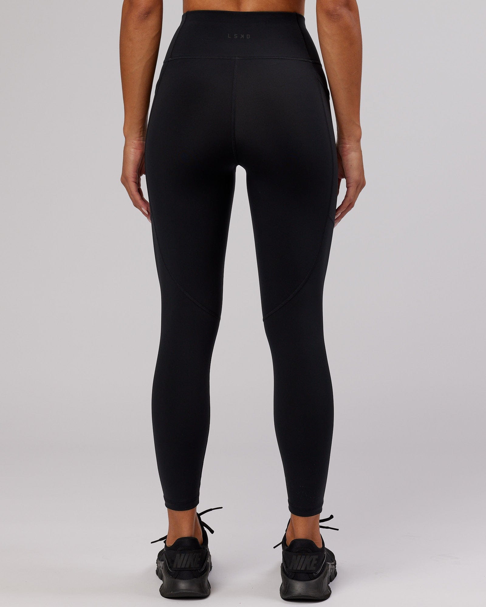 Model wearing Rep 7/8 Length Tight - Black-Cornflower Blue