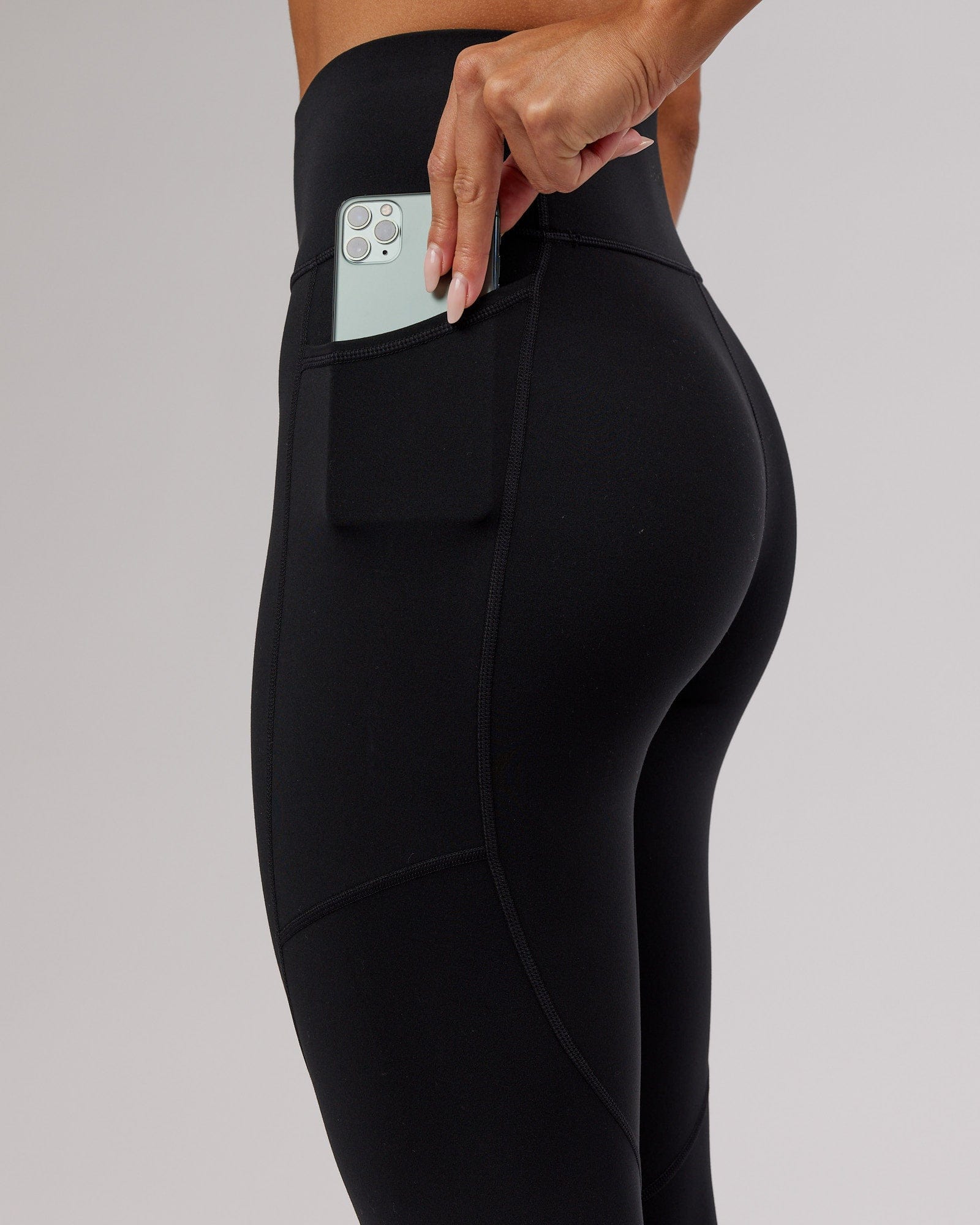 Model wearing Rep 7/8 Length Tight - Black-Flamingo
