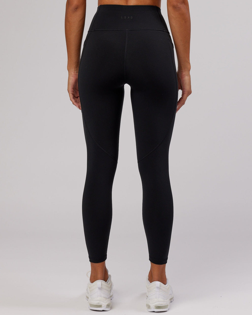 Model wearing Rep 7/8 Length Tight - Black-Flamingo