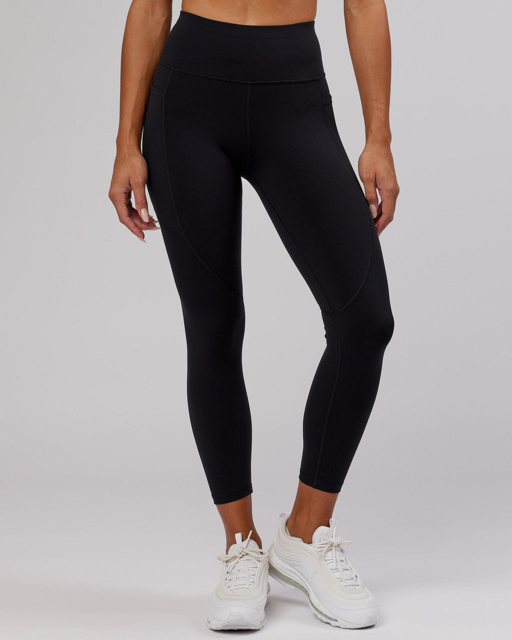 Model wearing Rep 7/8 Length Tight - Black-Hyper Teal