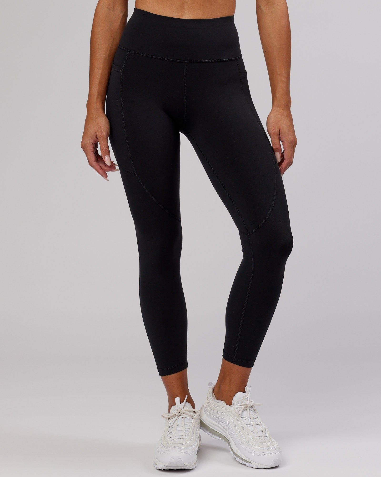 Model wearing Rep 7/8 Length Tight - Black-Hyper Teal