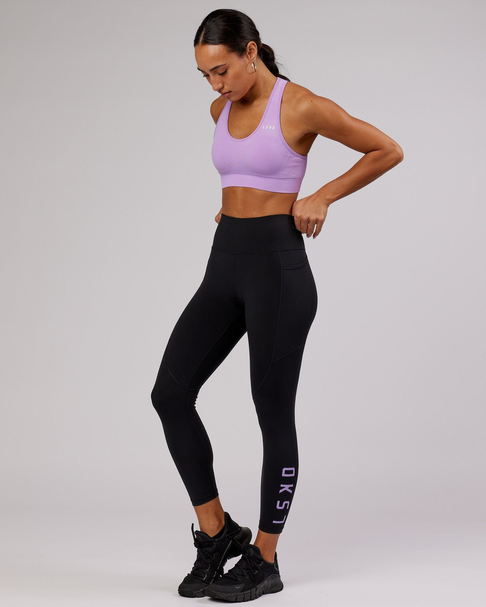 Model wearing Rep 7/8 Length Tight - Black-Lilac