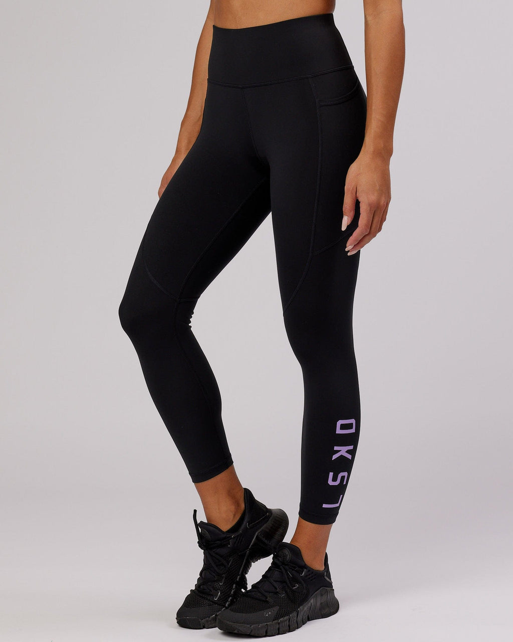 Model wearing Rep 7/8 Length Tight - Black-Lilac