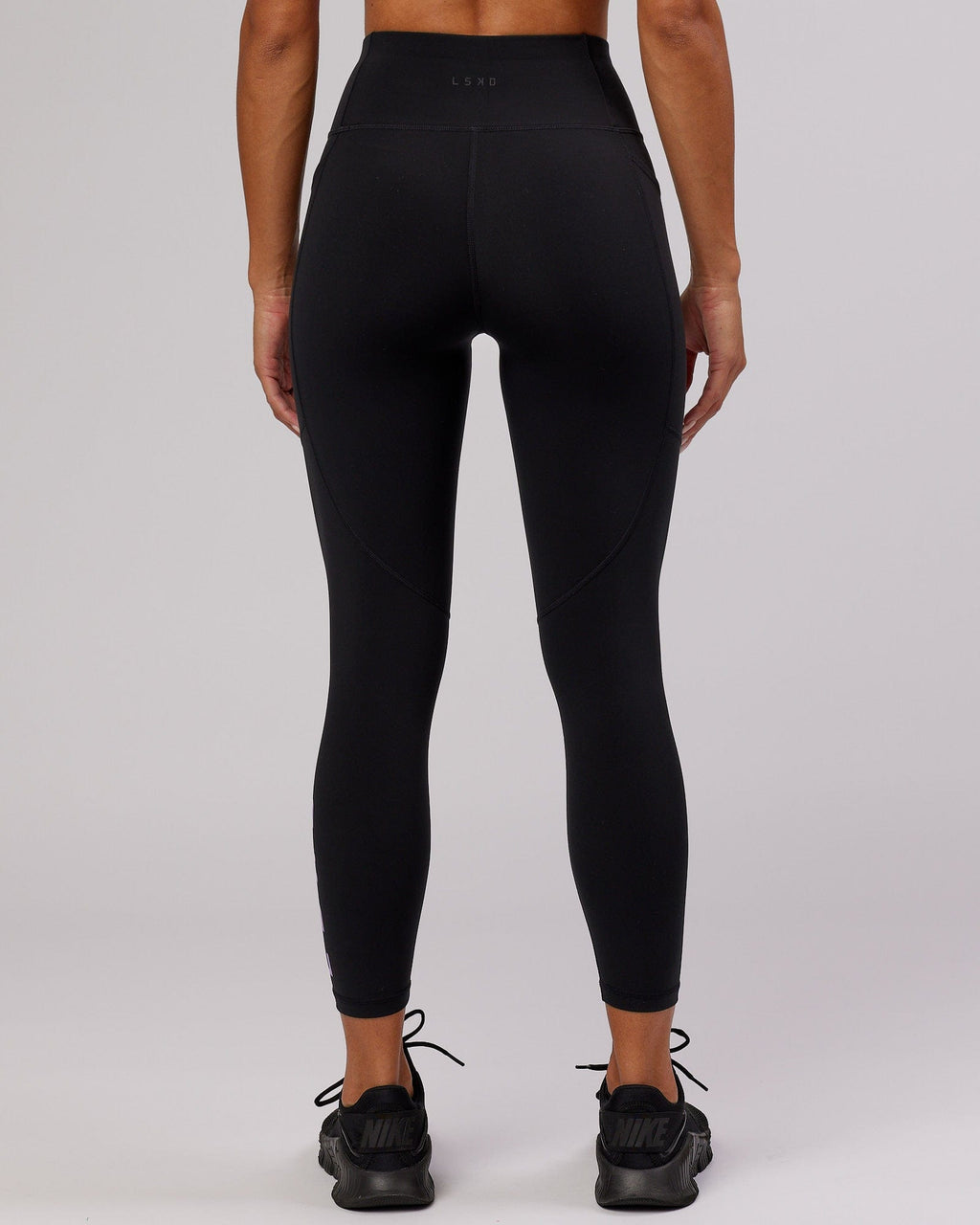 Model wearing Rep 7/8 Length Tight - Black-Lilac