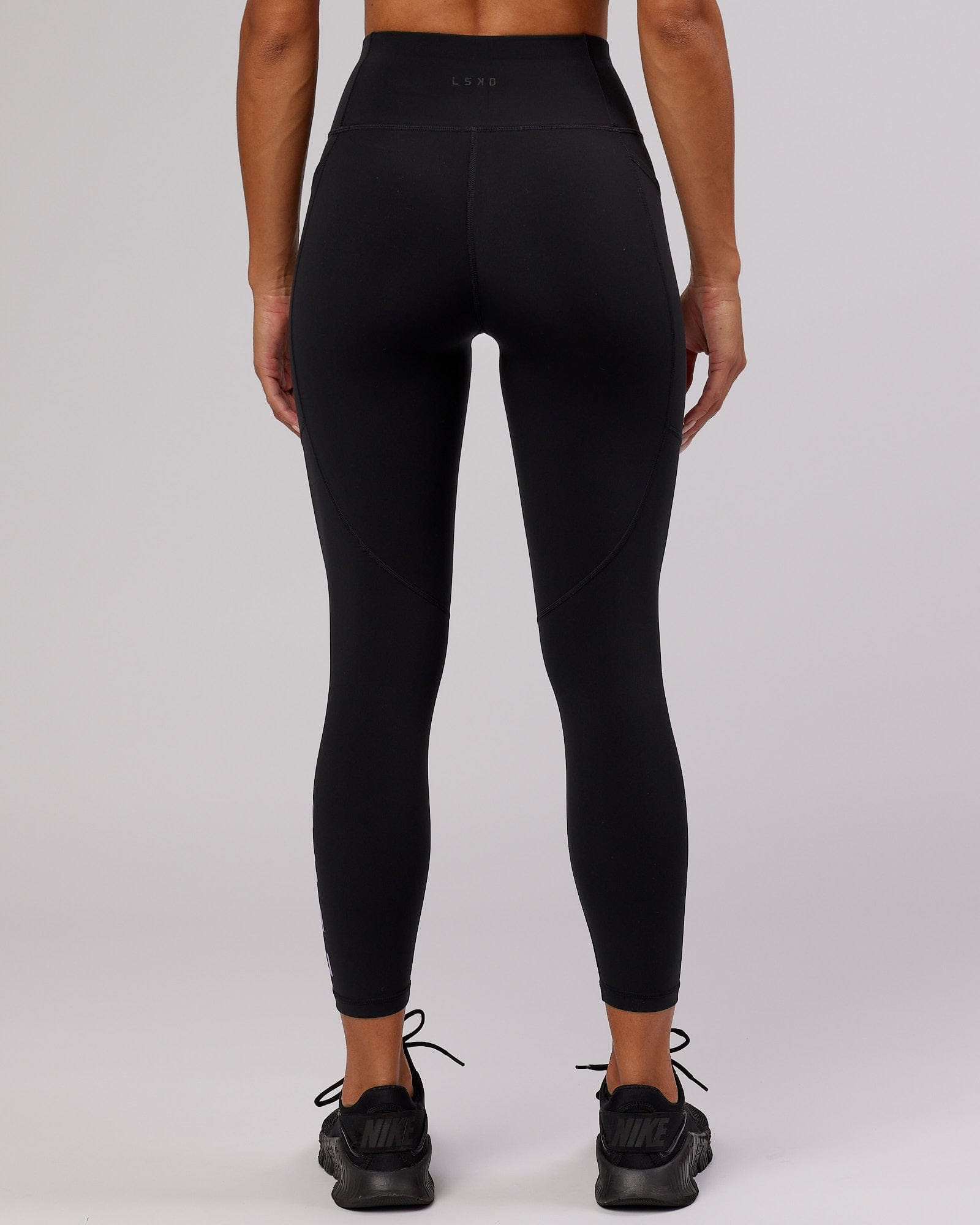 Model wearing Rep 7/8 Length Tight - Black-Lilac