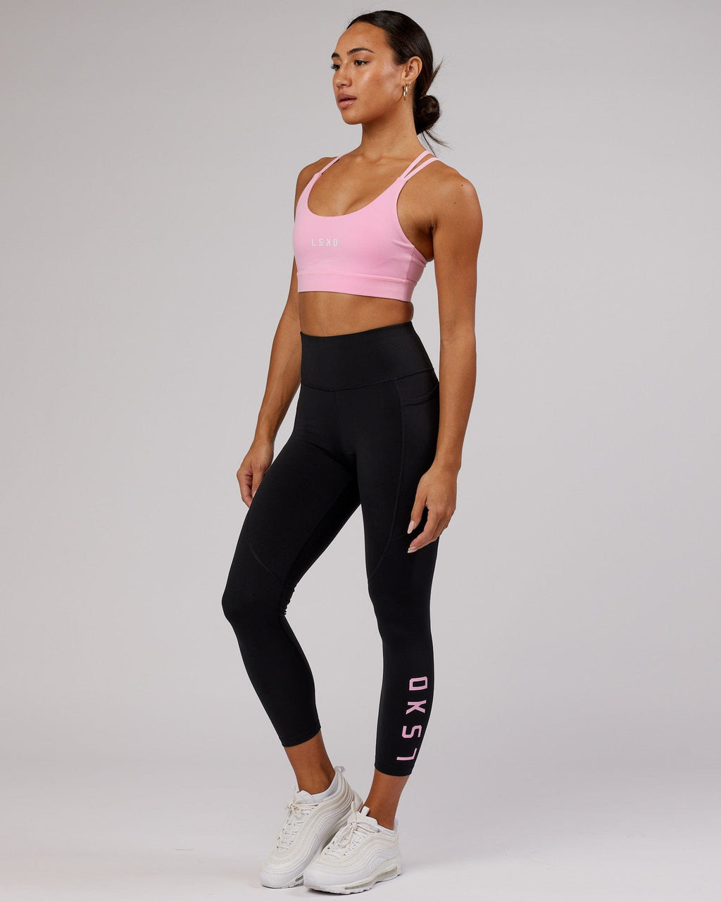 Model wearing Rep 7/8 Length Tight - Black-Pink Frosting