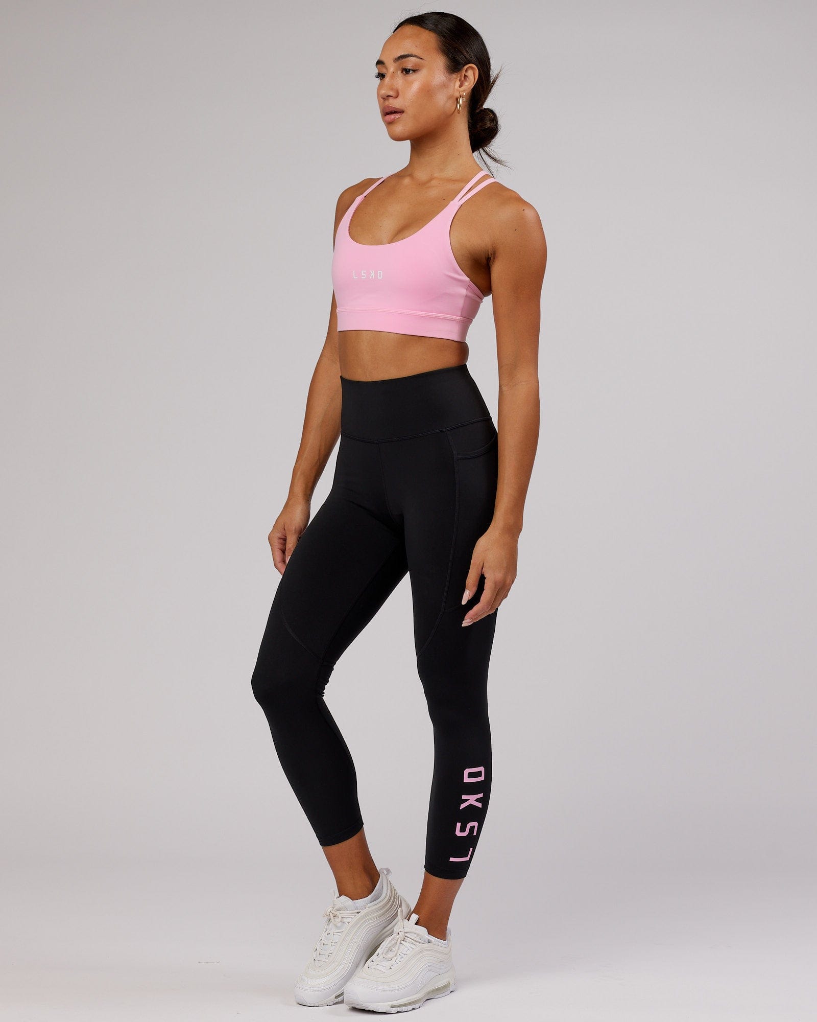 Model wearing Rep 7/8 Length Tight - Black-Pink Frosting