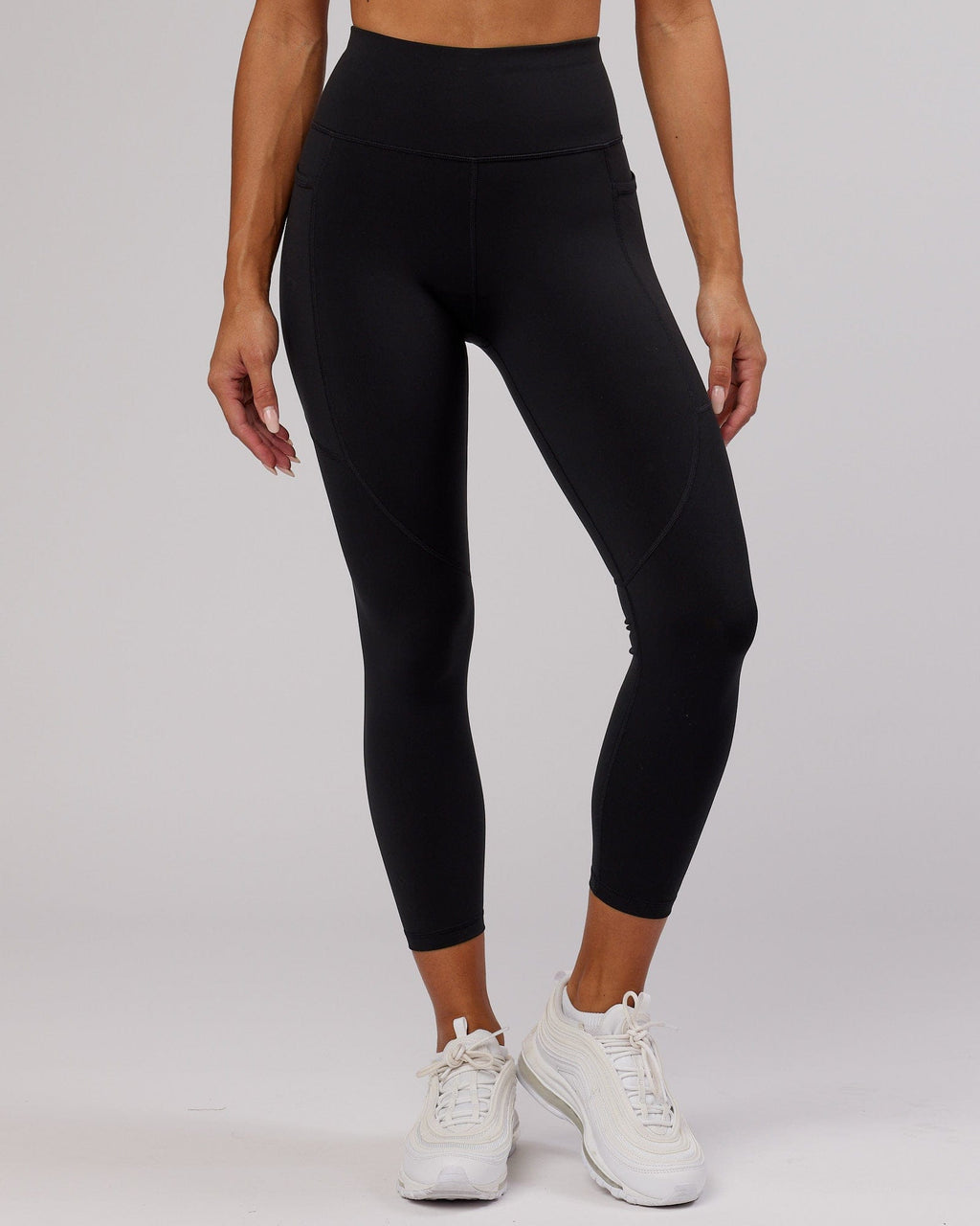 Model wearing Rep 7/8 Length Tight - Black-Pink Frosting