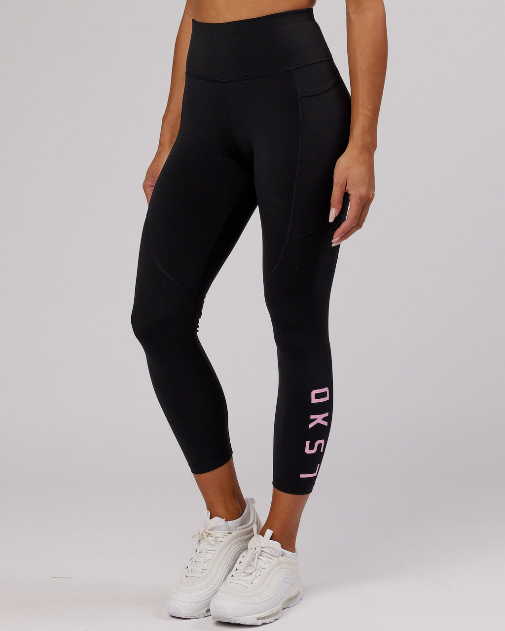 Model wearing Rep 7/8 Length Tight - Black-Pink Frosting