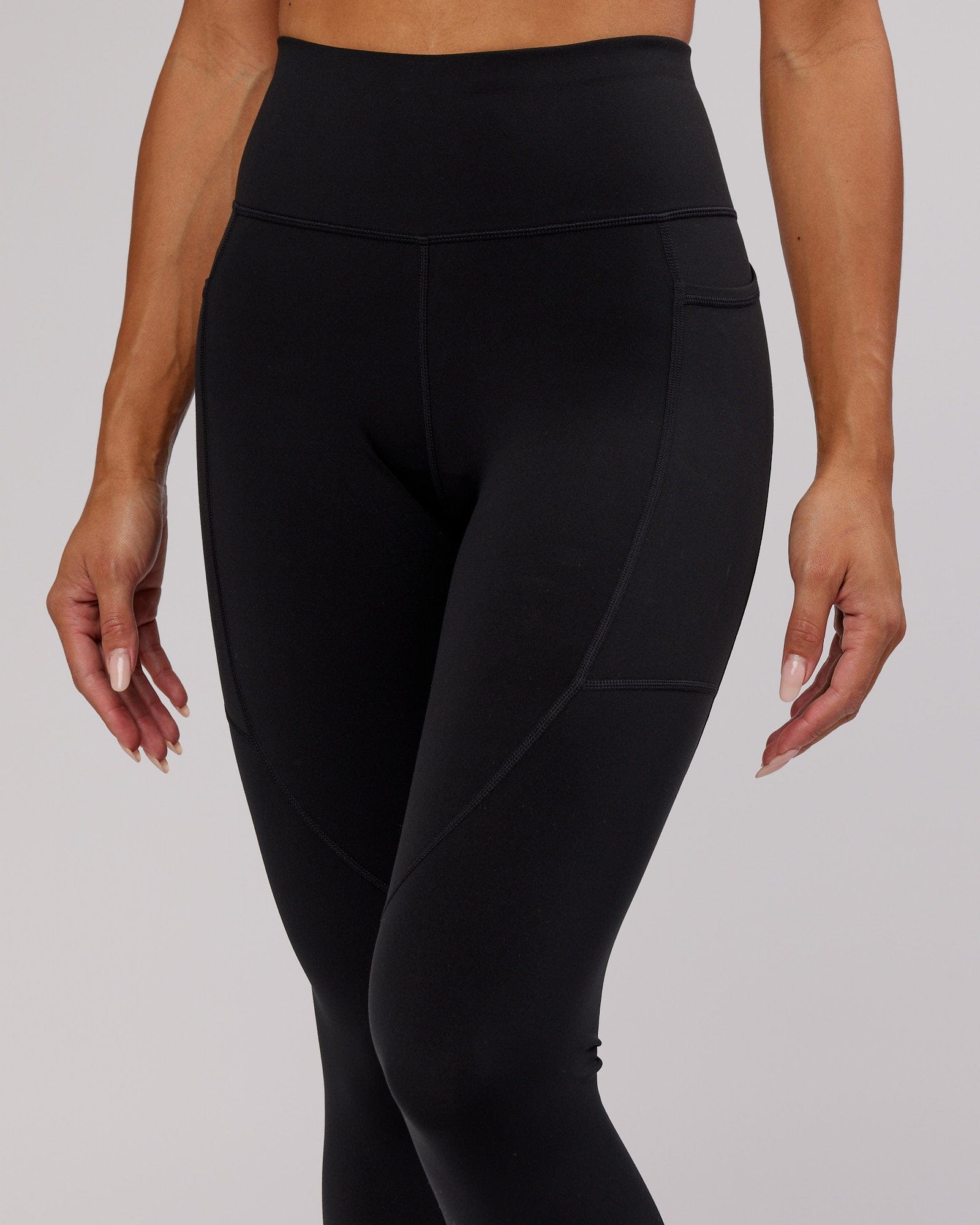 Model wearing Rep 7/8 Length Tight - Black-Pink Frosting