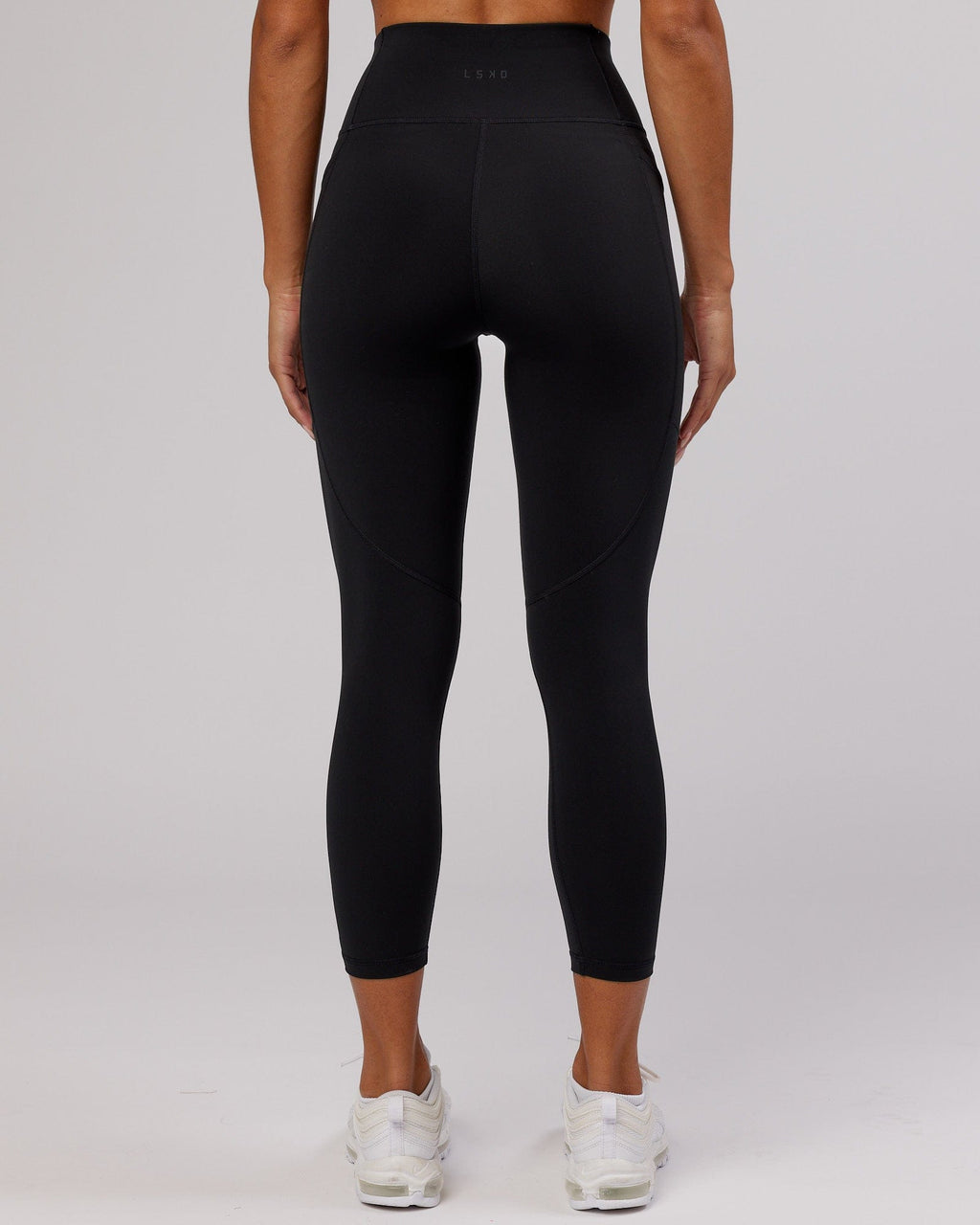 Model wearing Rep 7/8 Length Tight - Black-Pink Frosting