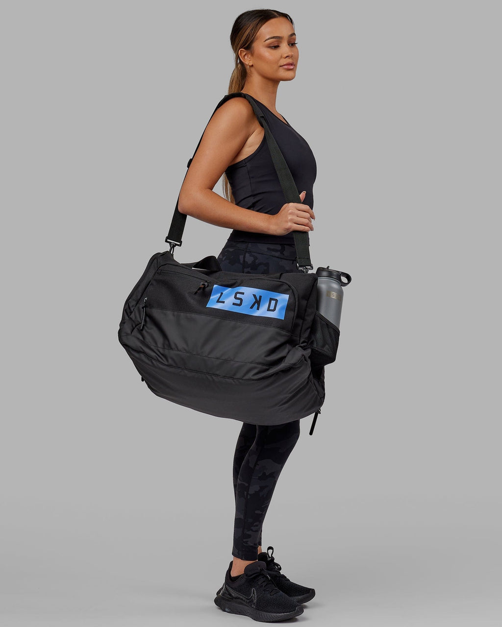 Model wearing Rep Duffle Bag 50L - Black-Cornflower Blue