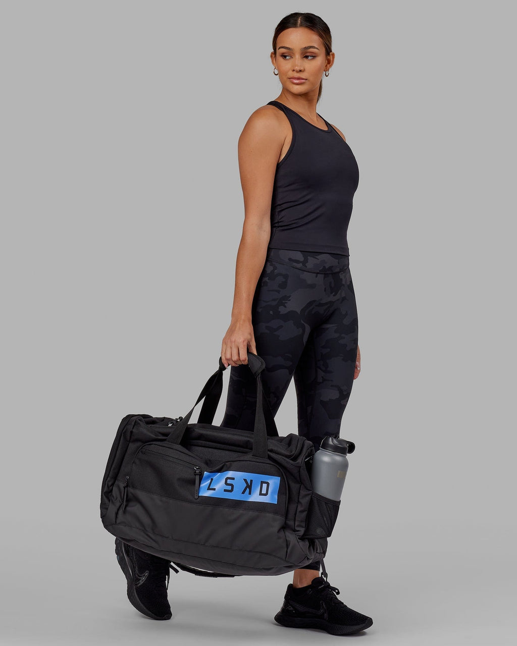 Model wearing Rep Duffle Bag 50L - Black-Cornflower Blue