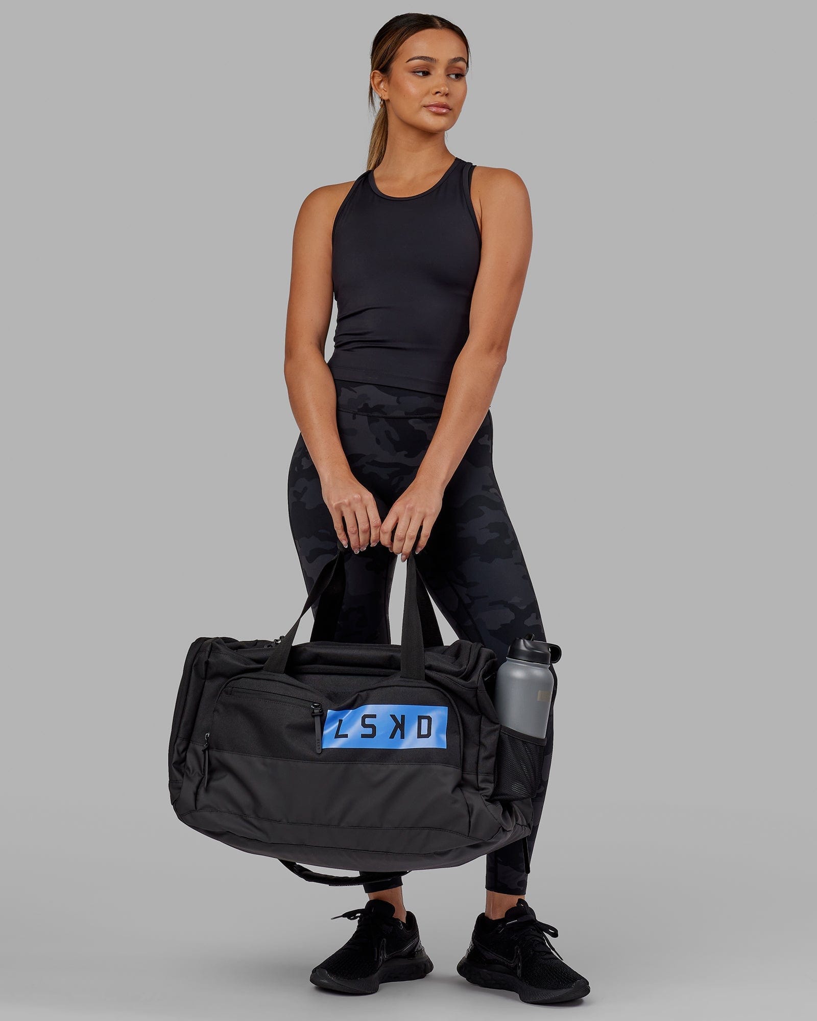 Model wearing Rep Duffle Bag 50L - Black-Cornflower Blue