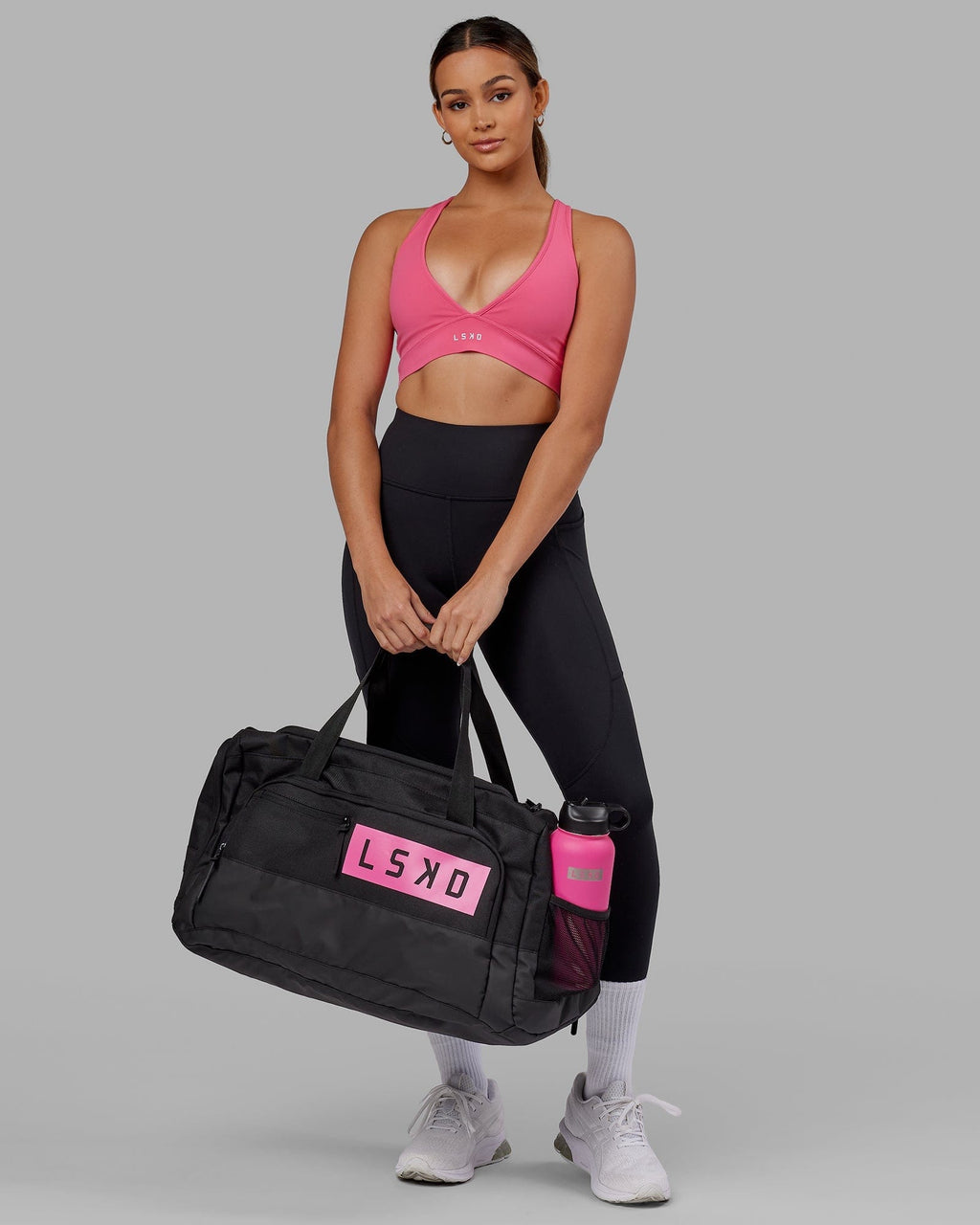 Model wearing Rep Duffle Bag 50L - Black-Flamingo
