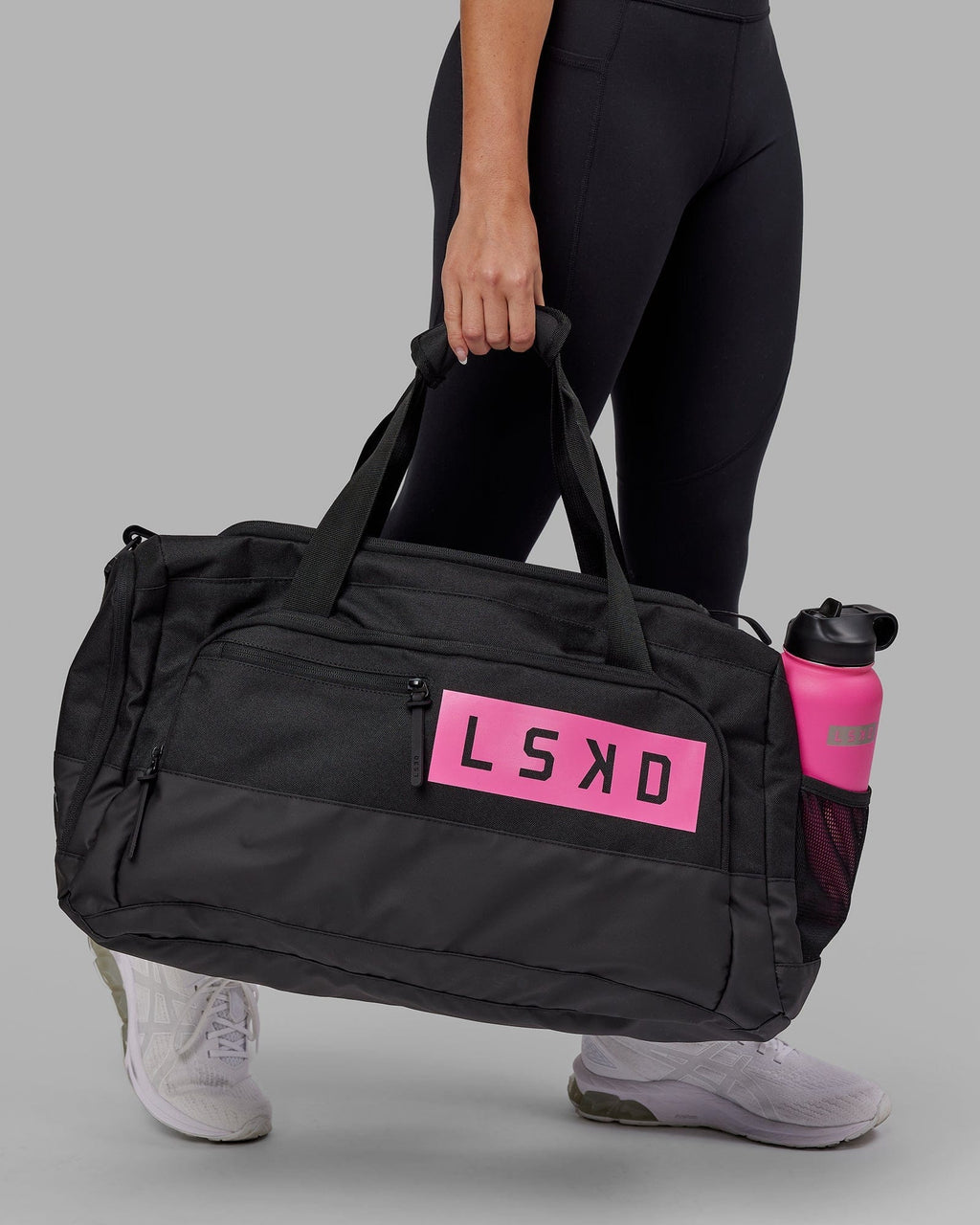 Model wearing Rep Duffle Bag 50L - Black-Flamingo