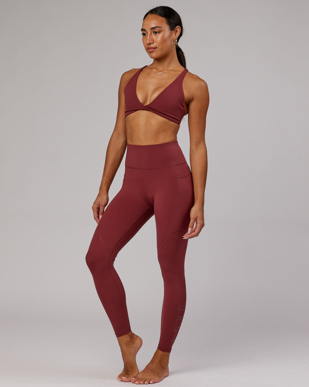 Model wearing Rep Full Length Tight - Apple Berry