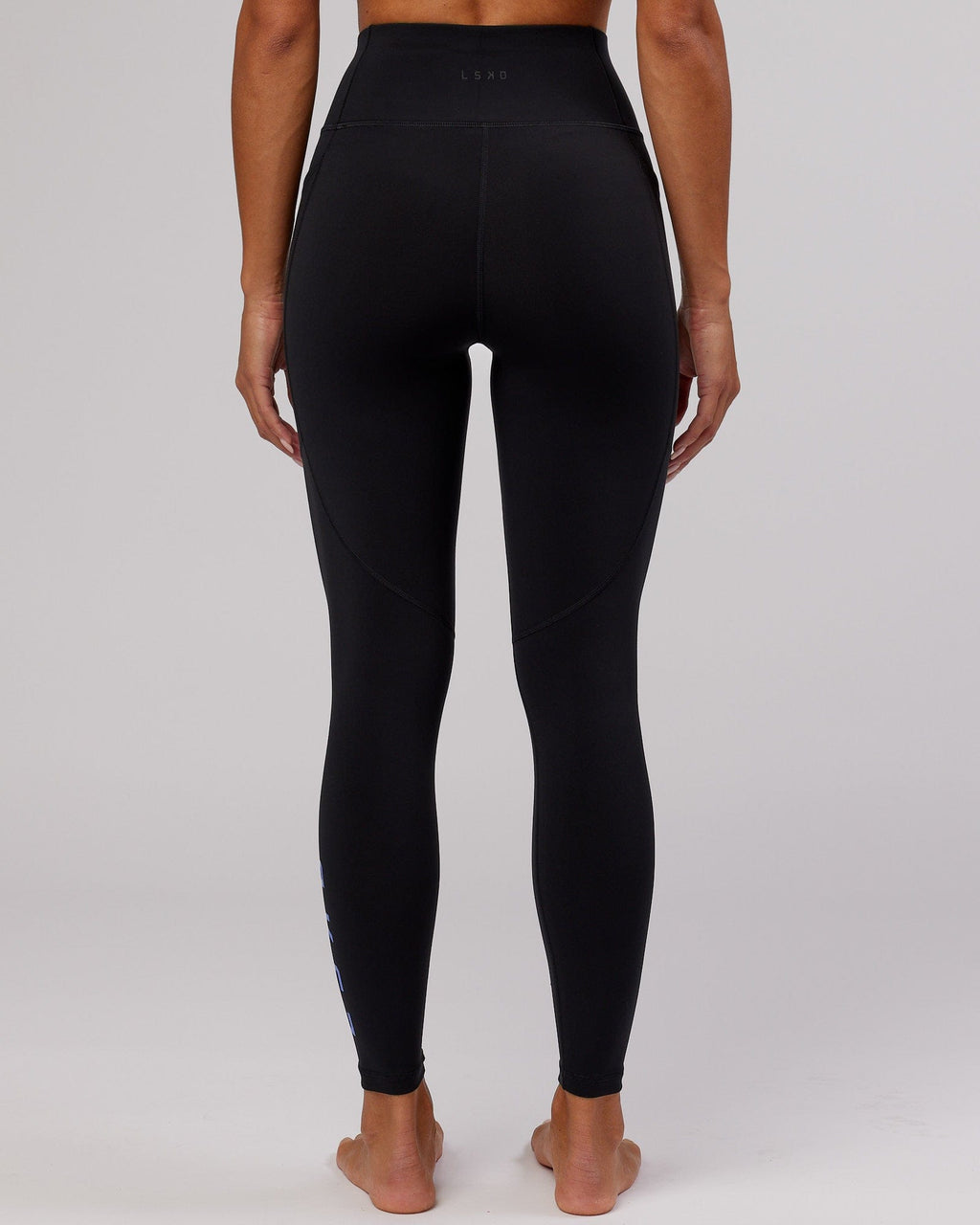 Model wearing Rep Full Length Tight - Black-Cornflower Blue