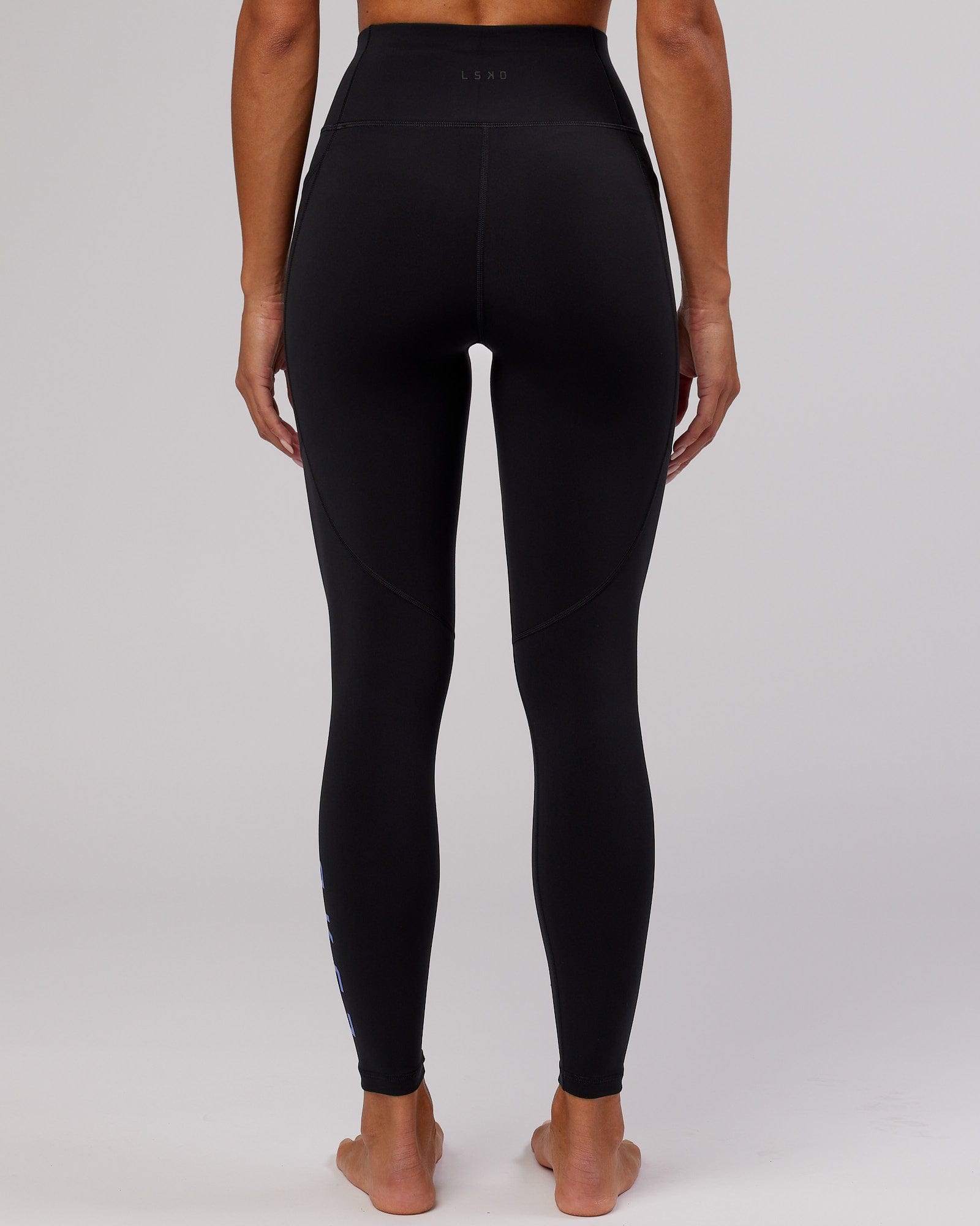 Model wearing Rep Full Length Tight - Black-Cornflower Blue