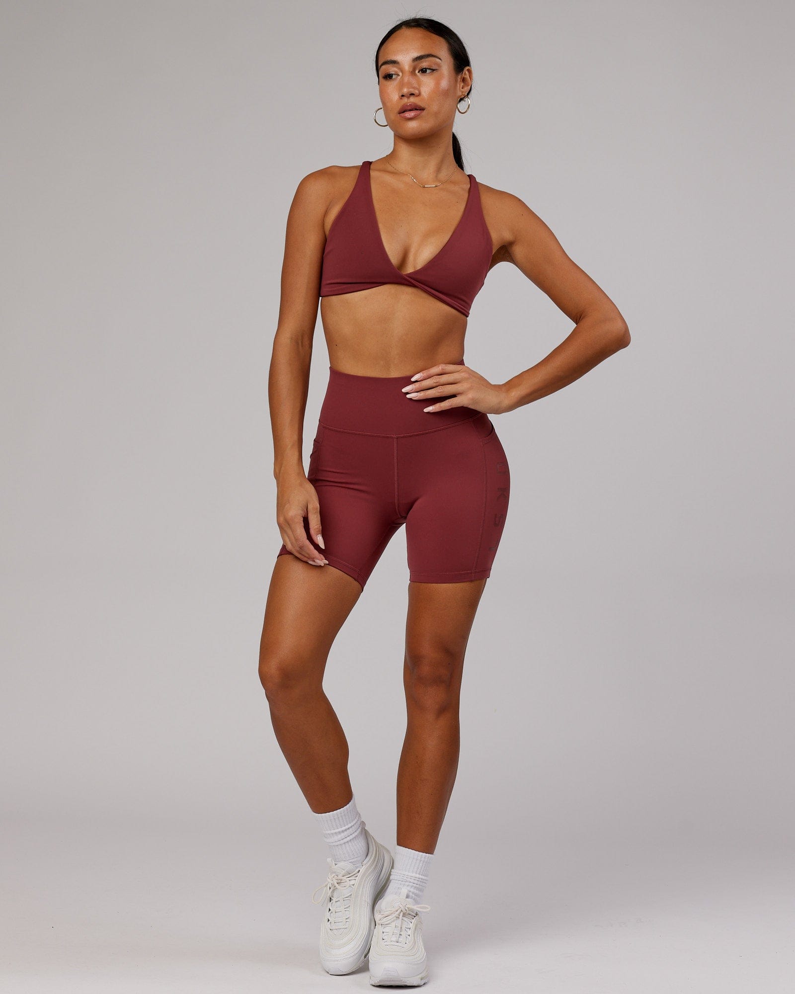 Model wearing Rep Mid Short Tight - Apple Berry