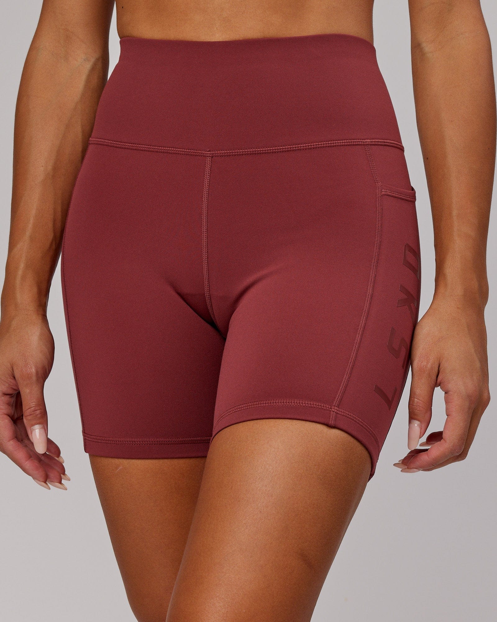 Model wearing Rep Mid Short Tight - Apple Berry