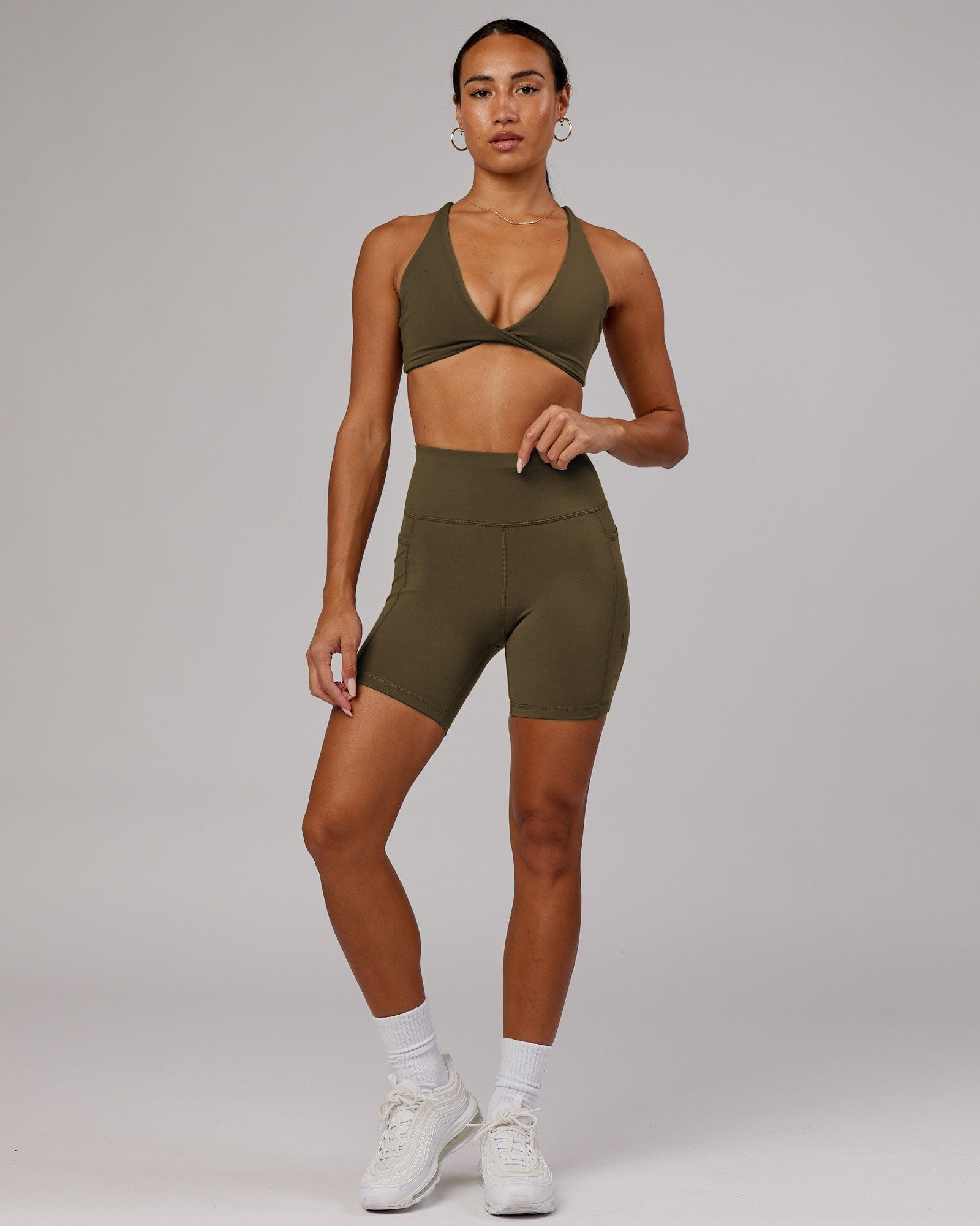 Model wearing Rep Mid Short Tight - Army Green