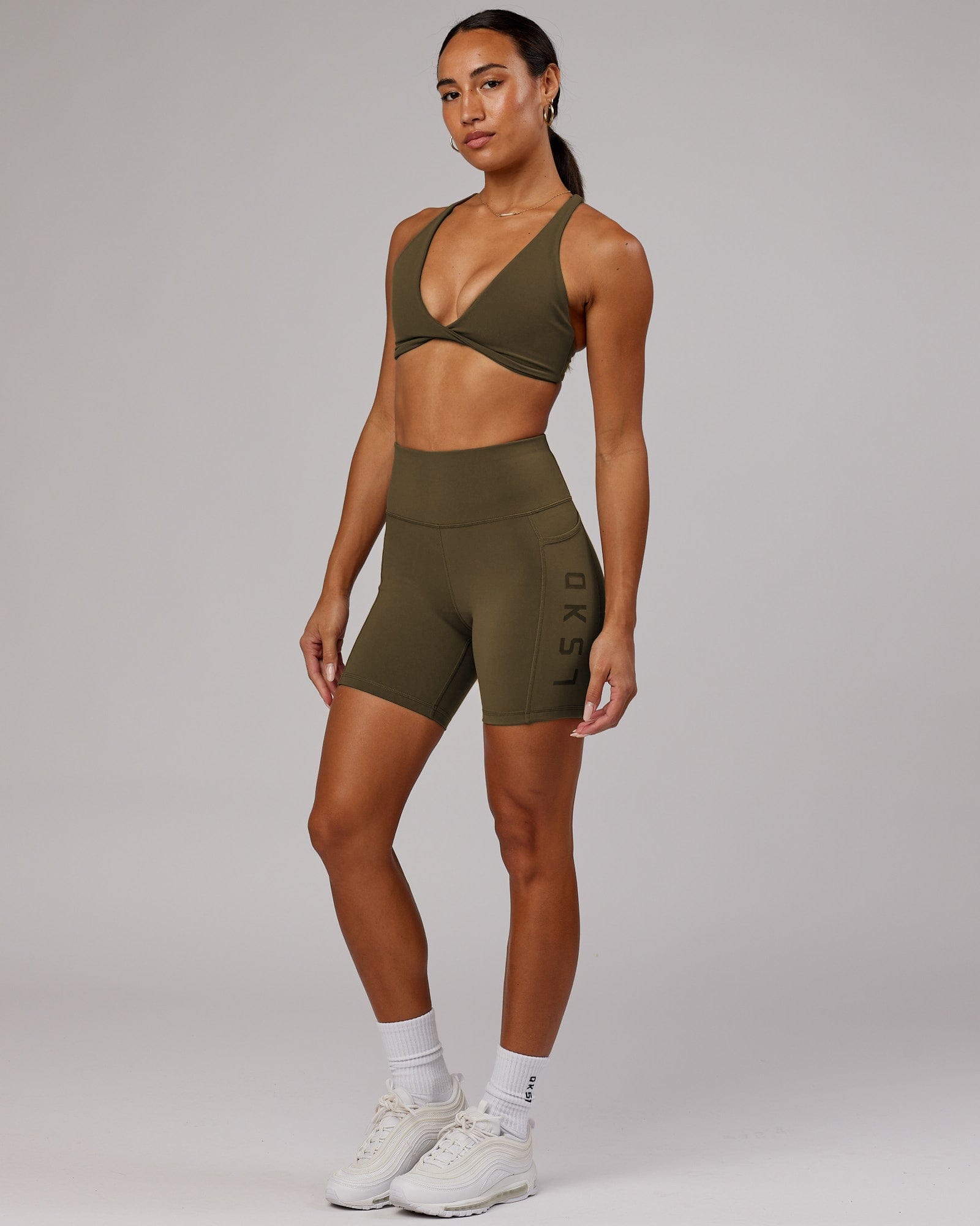 Model wearing Rep Mid Short Tight - Army Green