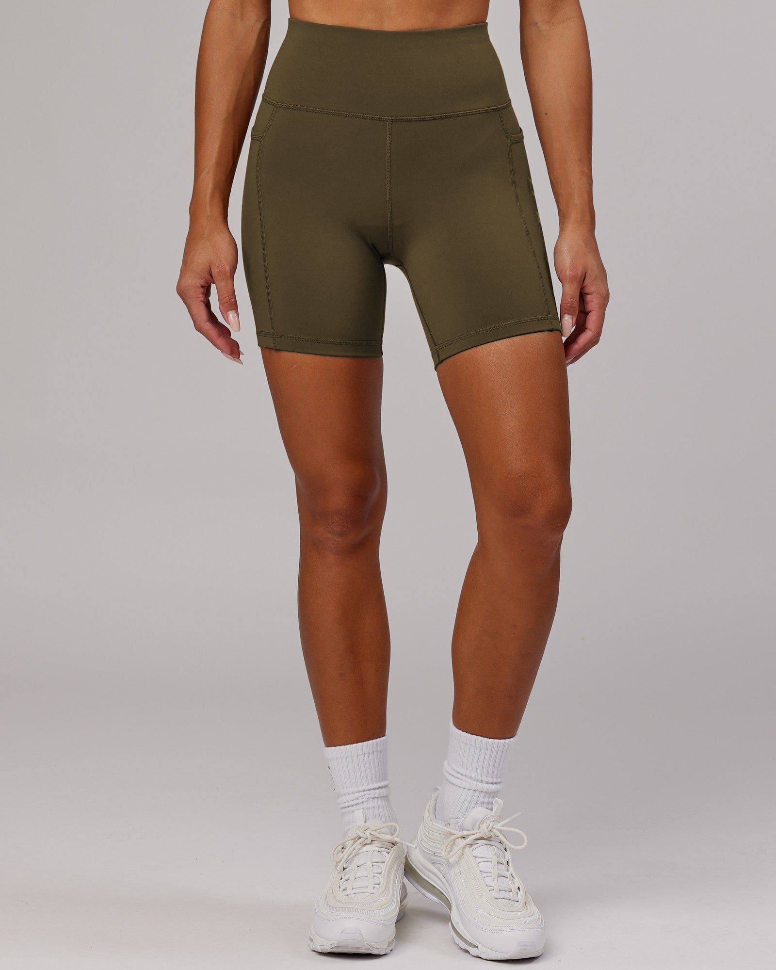 Model wearing Rep Mid Short Tight - Army Green