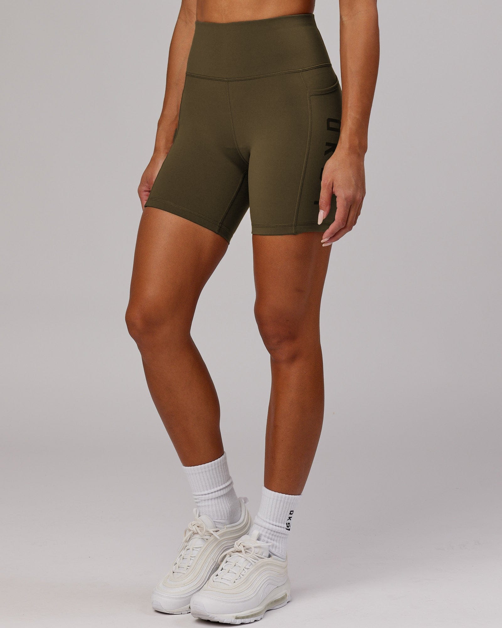 Model wearing Rep Mid Short Tight - Army Green